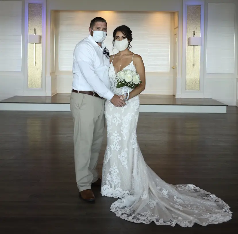 Groom With Bride Wearing Lace Sheath Wedding Dress Tuscany Lynette By Maggie Sottero