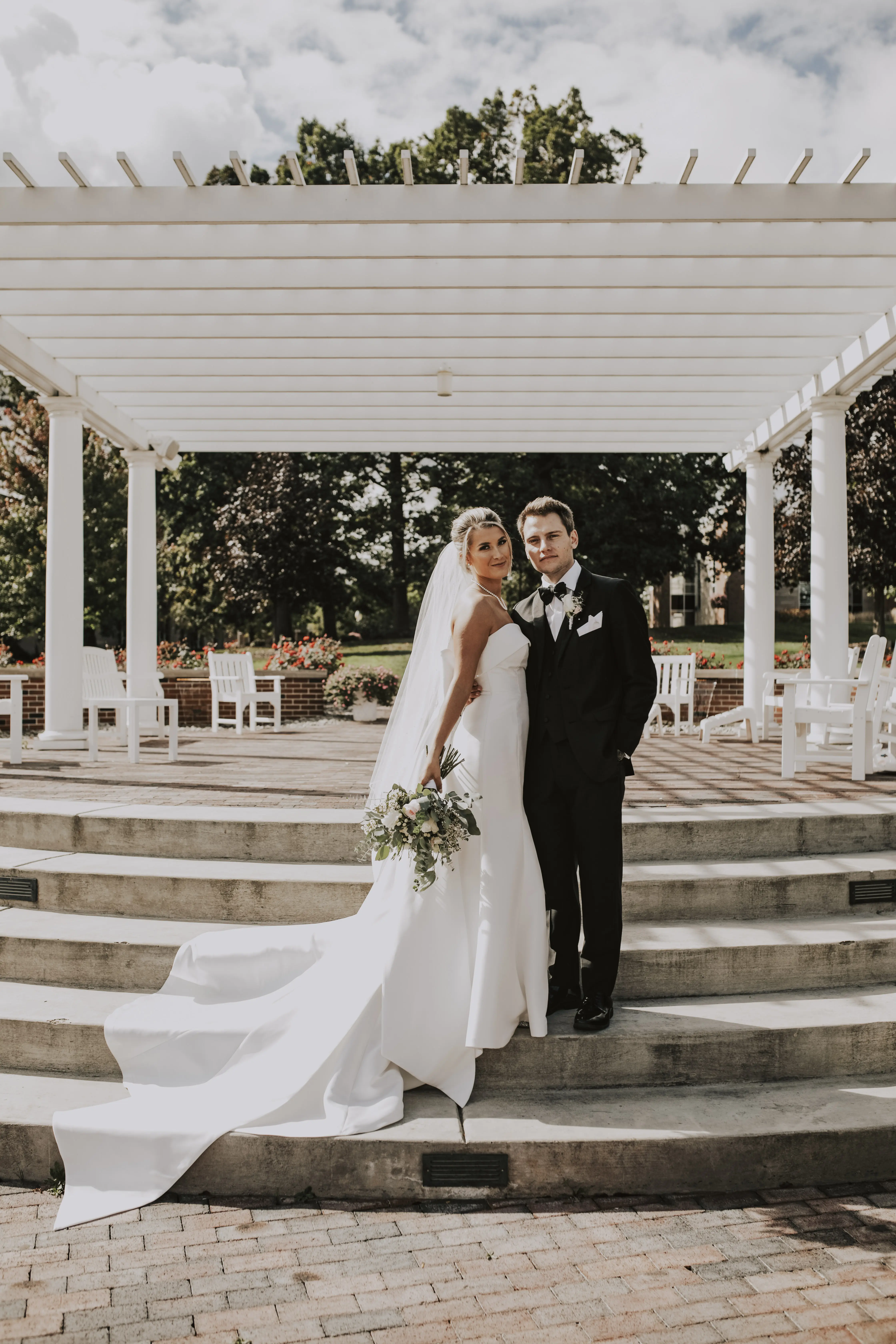 Bride wearing Mitchell wedding dress by Maggie Sottero with her husband