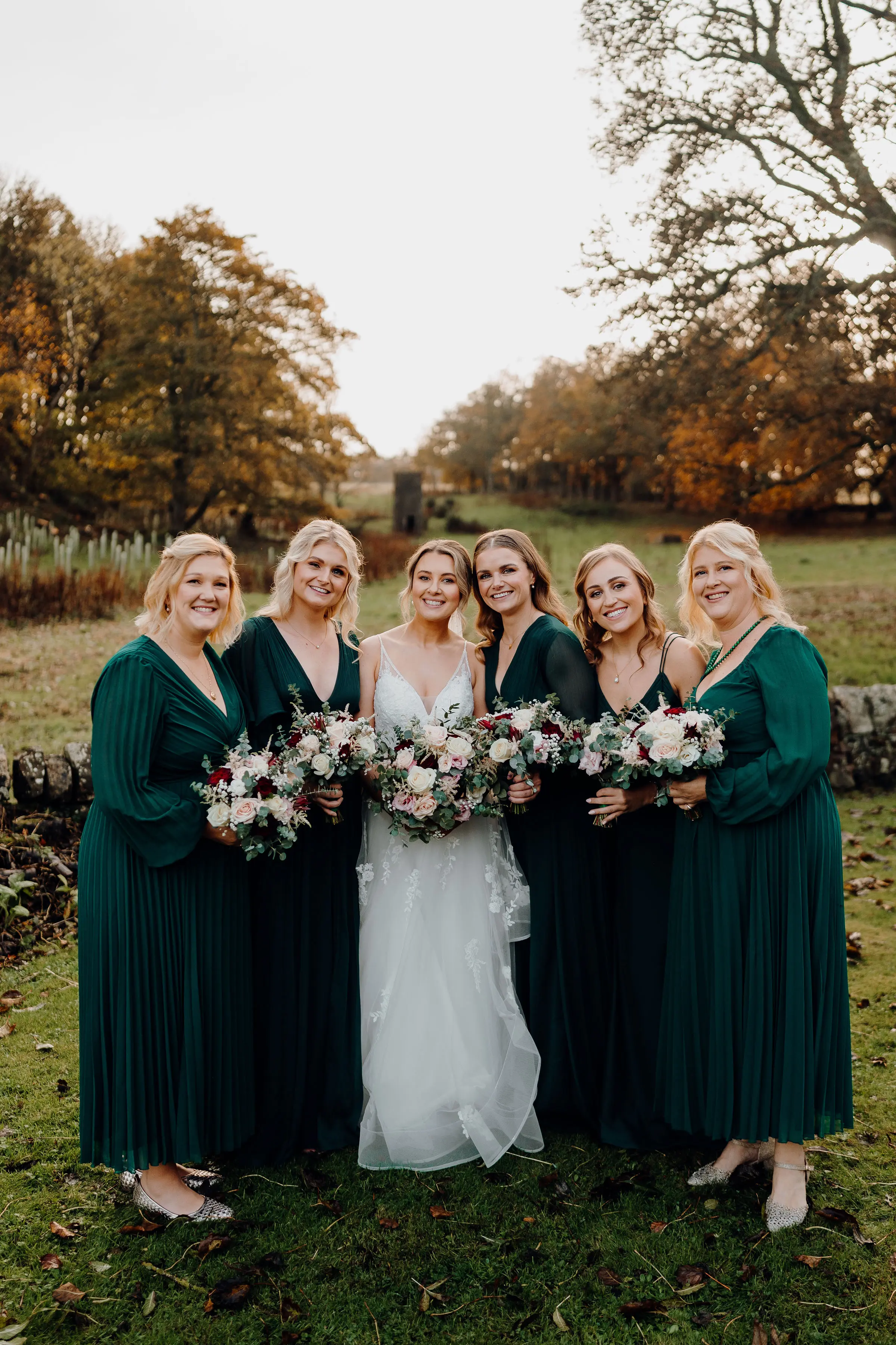 Bride wearing Lettie wedding dress by Rebecca Ingram with her bridesmaids