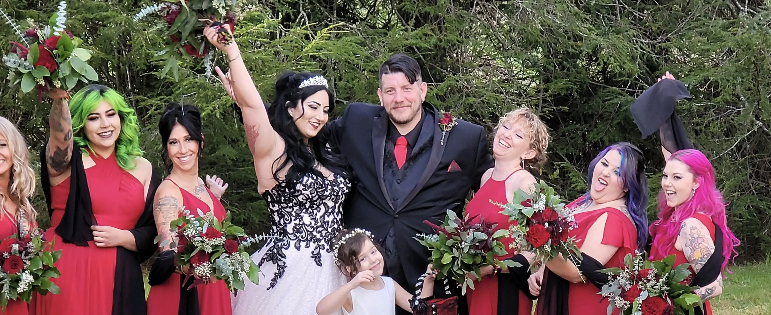 Bride wearing Black Lace Ballgown Wedding Dress called Tristyn by Maggie Sottero with Groom and their wedding party
