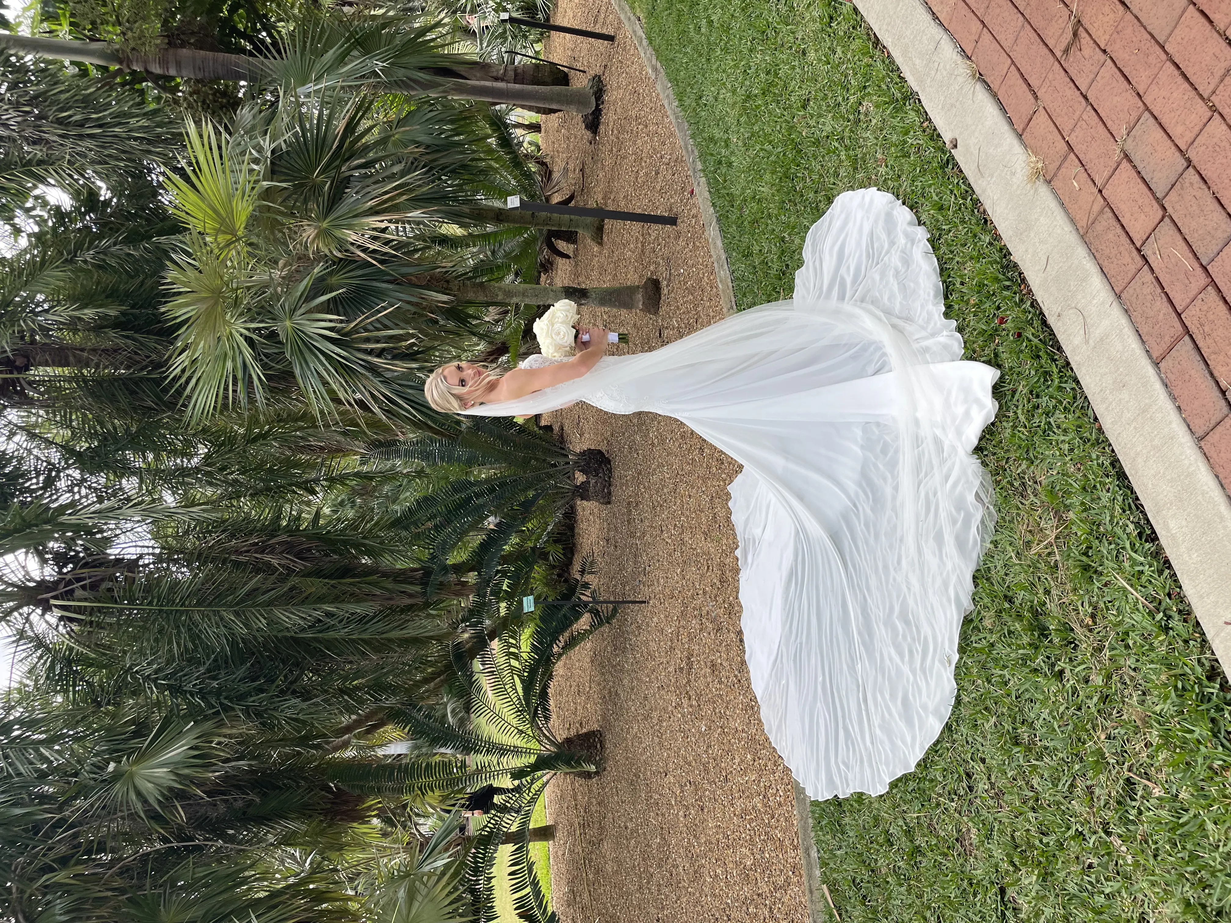 Real Bride in Fit-and-Flare Strapless Chiffon Wedding Gown with Sequined Lace Motifs over Chantilly Lace with Corset Detailing Called Giovannetta by Sottero & Midgley