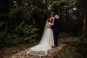 Groom Kissing Bride in A-Line Wedding Dress with Allover Sequin Lace Called Roxanne by Sottero & Midgley