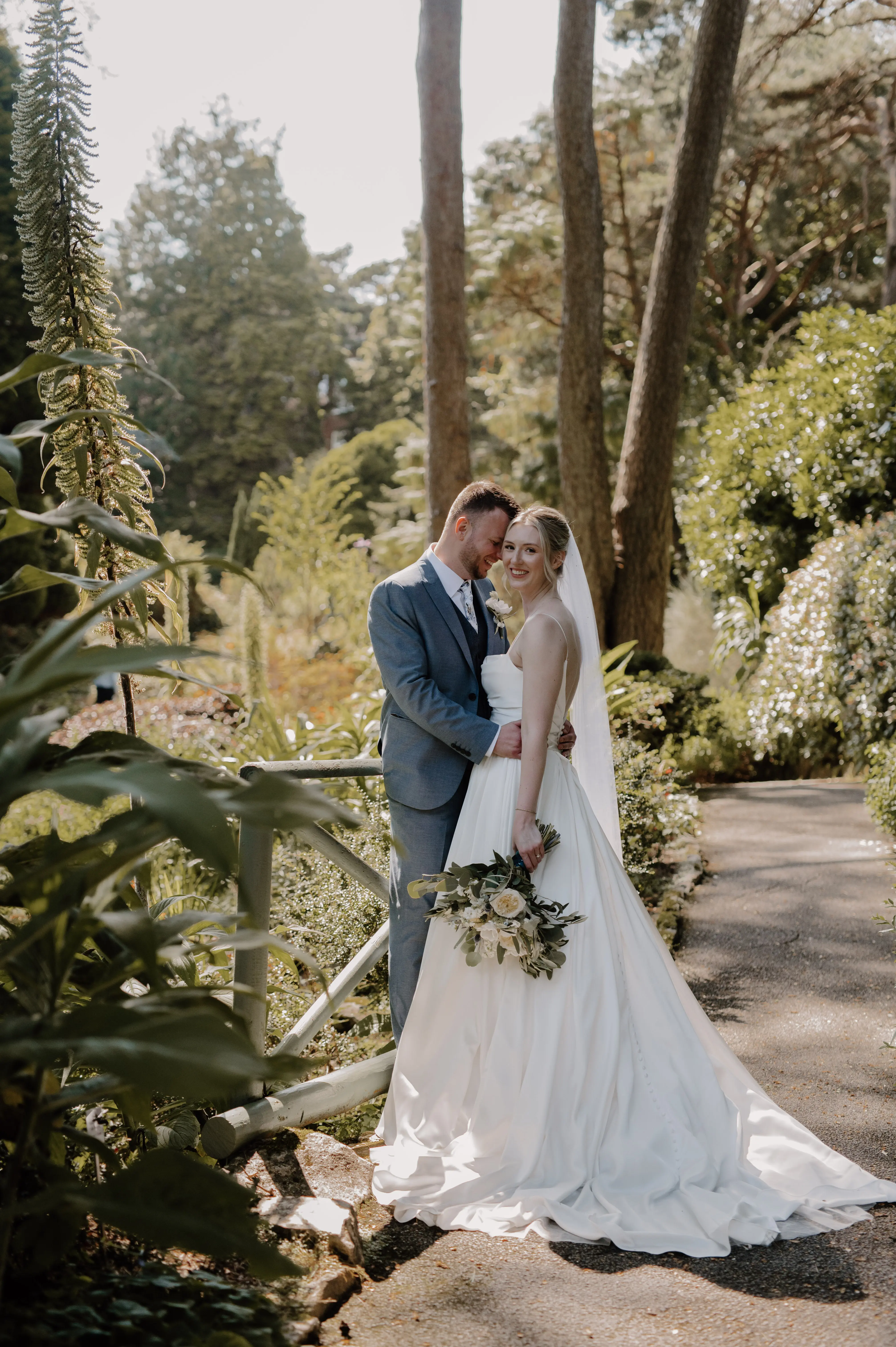 Bride wearing Scarlet by Maggie Sottero being held by her husband