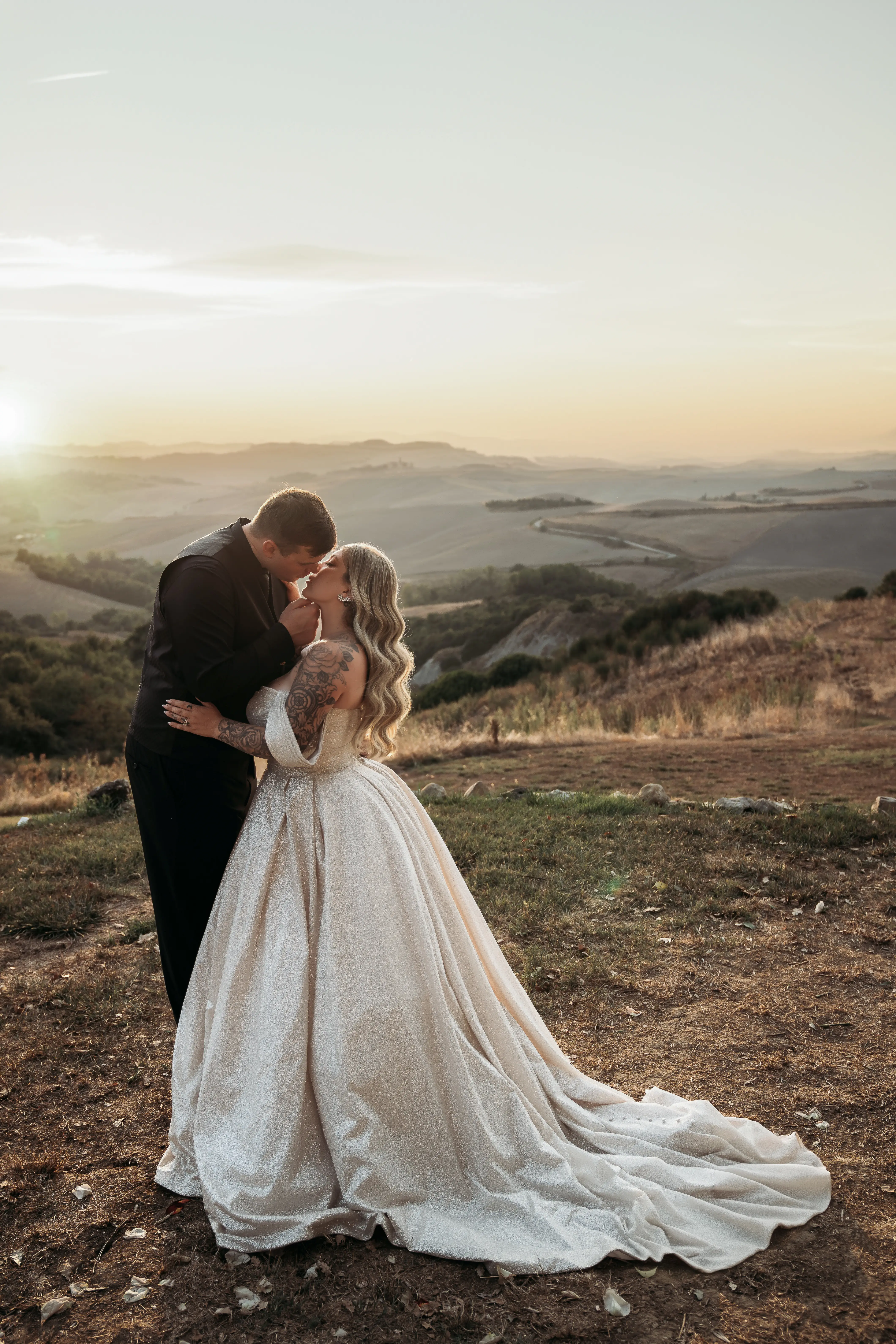 Bride wearing Anniston by Maggie Sottero kissing her husband