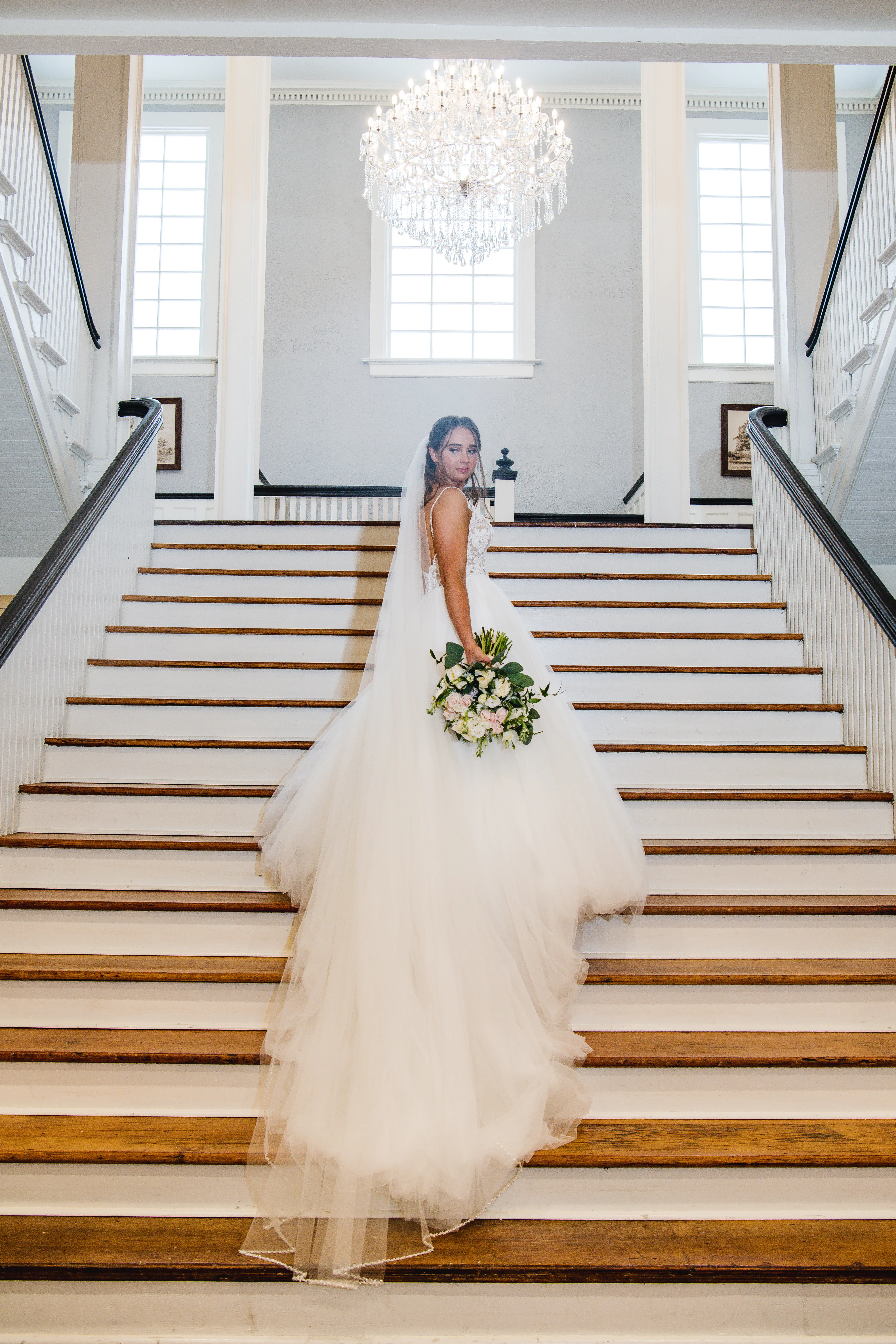 Bride wearing a boho princess wedding dress in lace and tulle