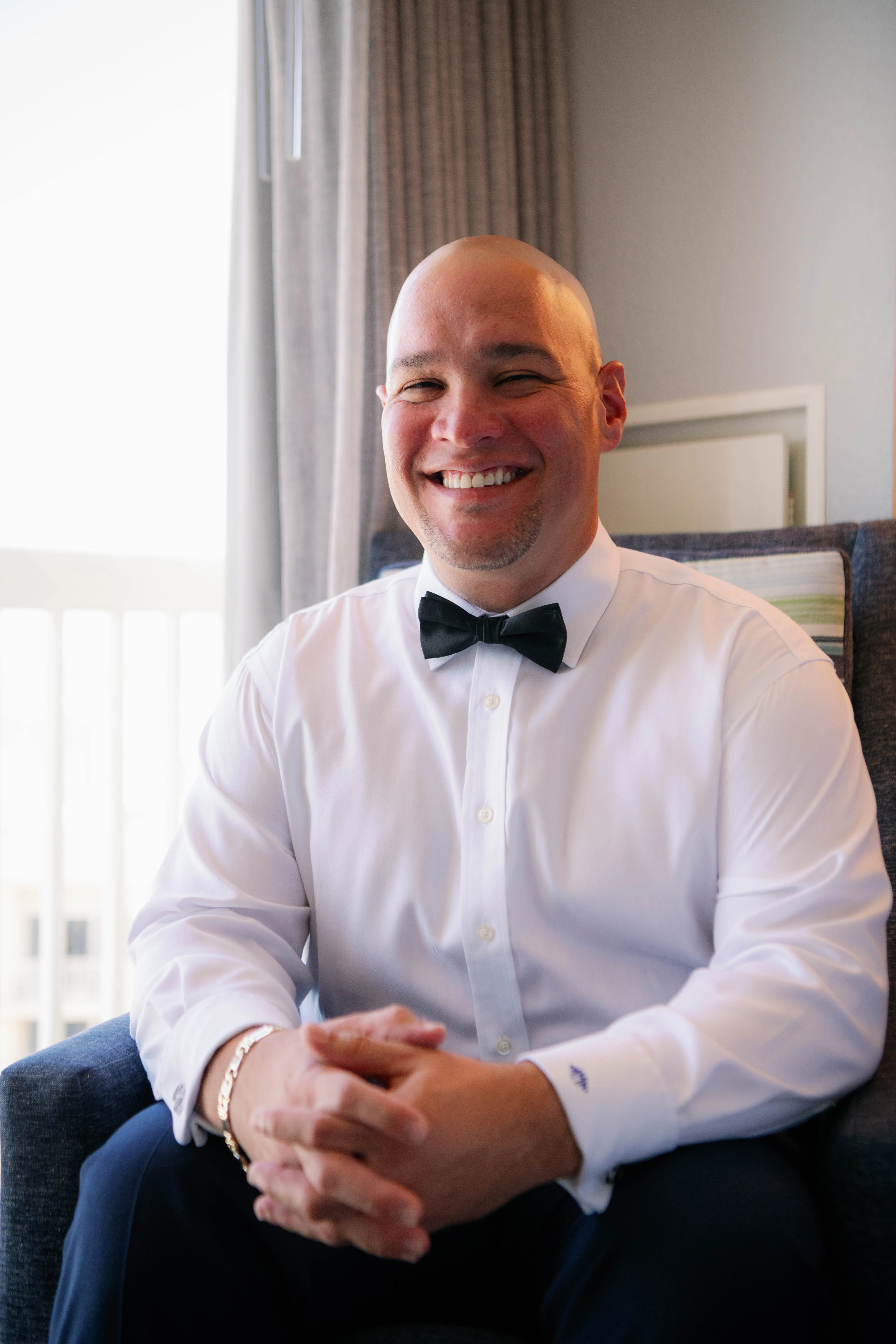 Groom In A White Shirt and Black Bowtie