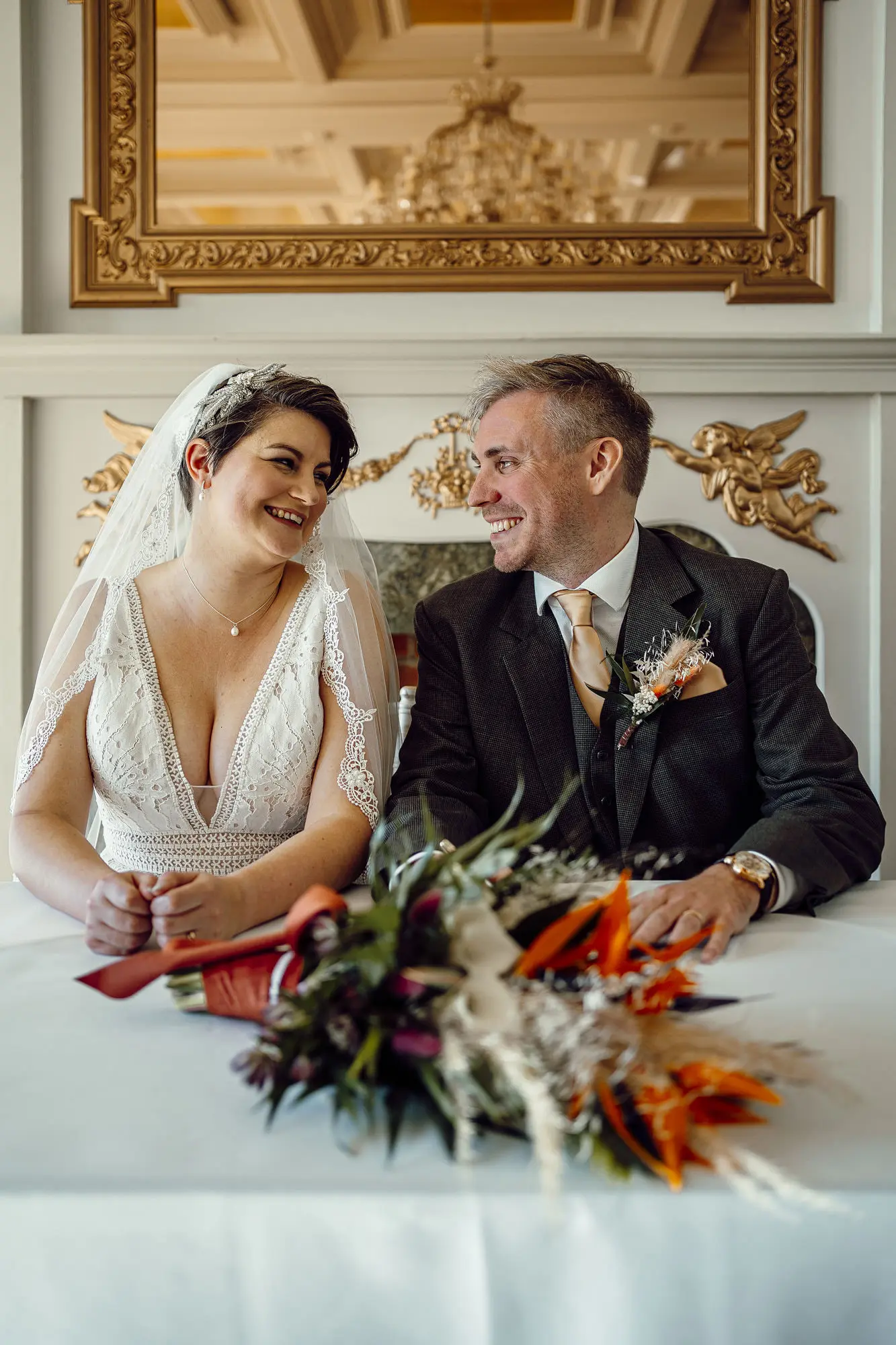 Bride Wearing Boho Lace Wedding Dress Called Burke By Maggie Sottero Smiling At Groom