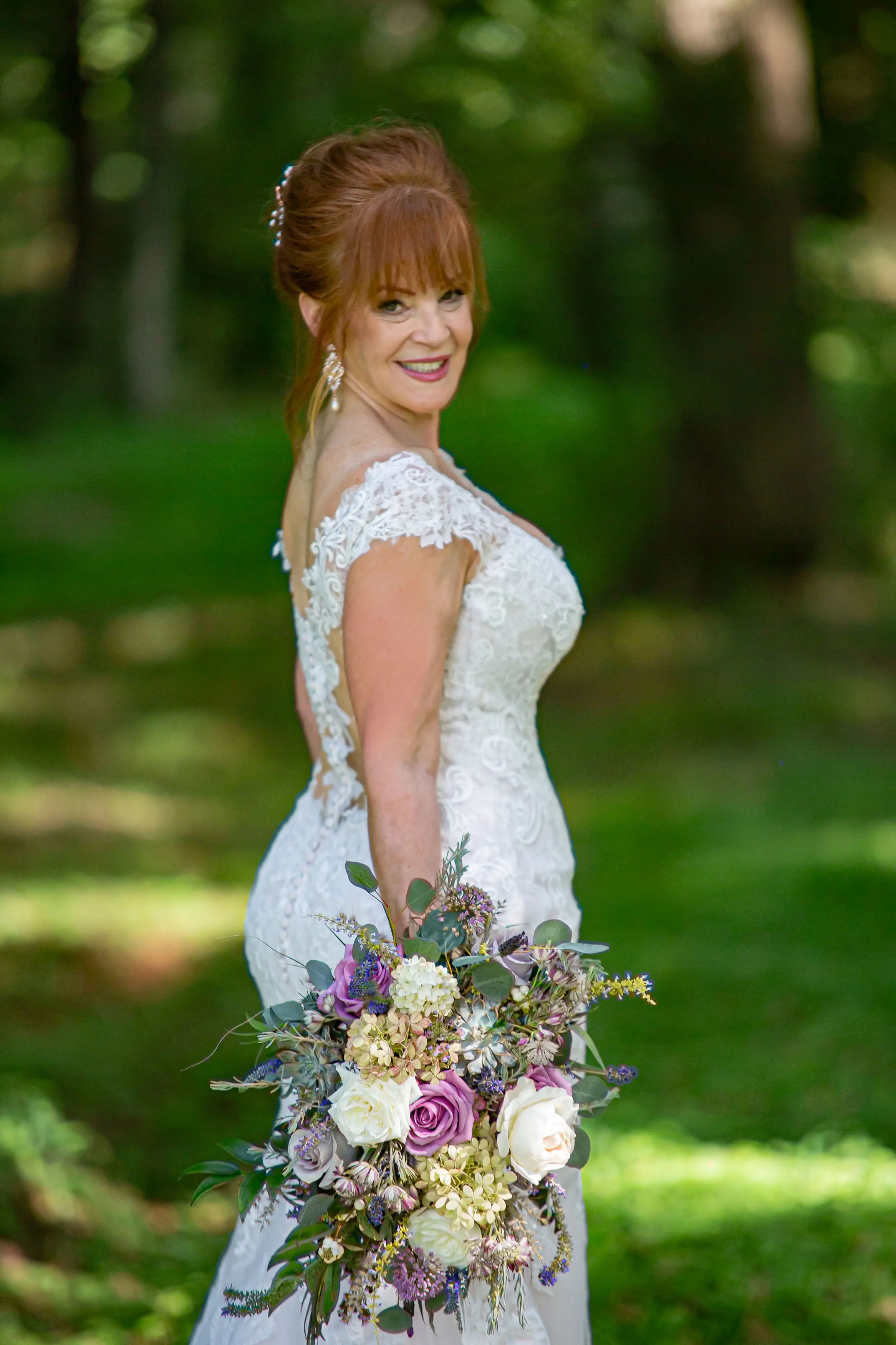 Bride at Outdoor Wedding Wearing a Lace Bridal Dress Called Daphne Lynette by Rebecca Ingram