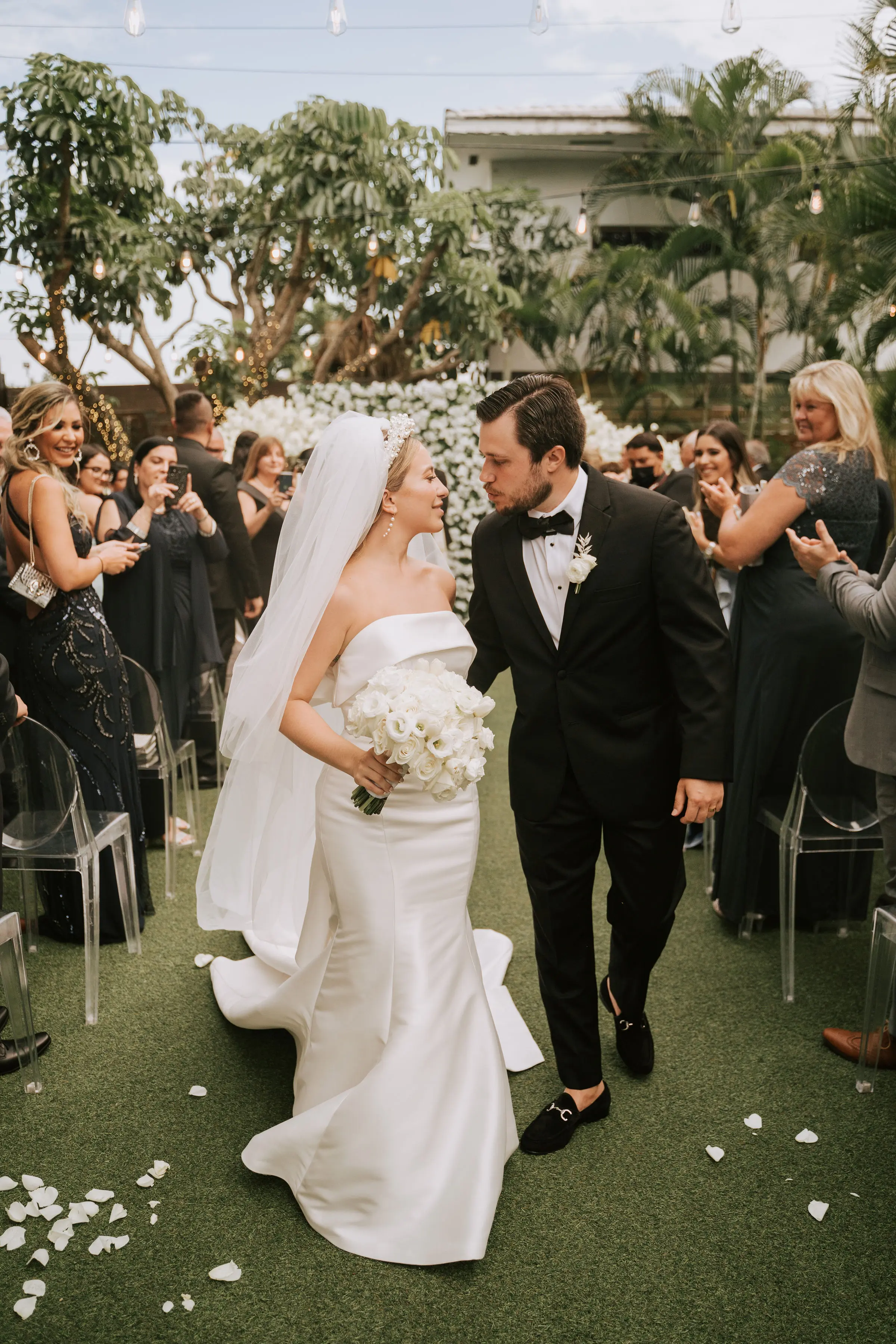 Groom With Bride Wearing Simple Sheath Satin Dress With Back Bow Mitchell By Maggie Sottero