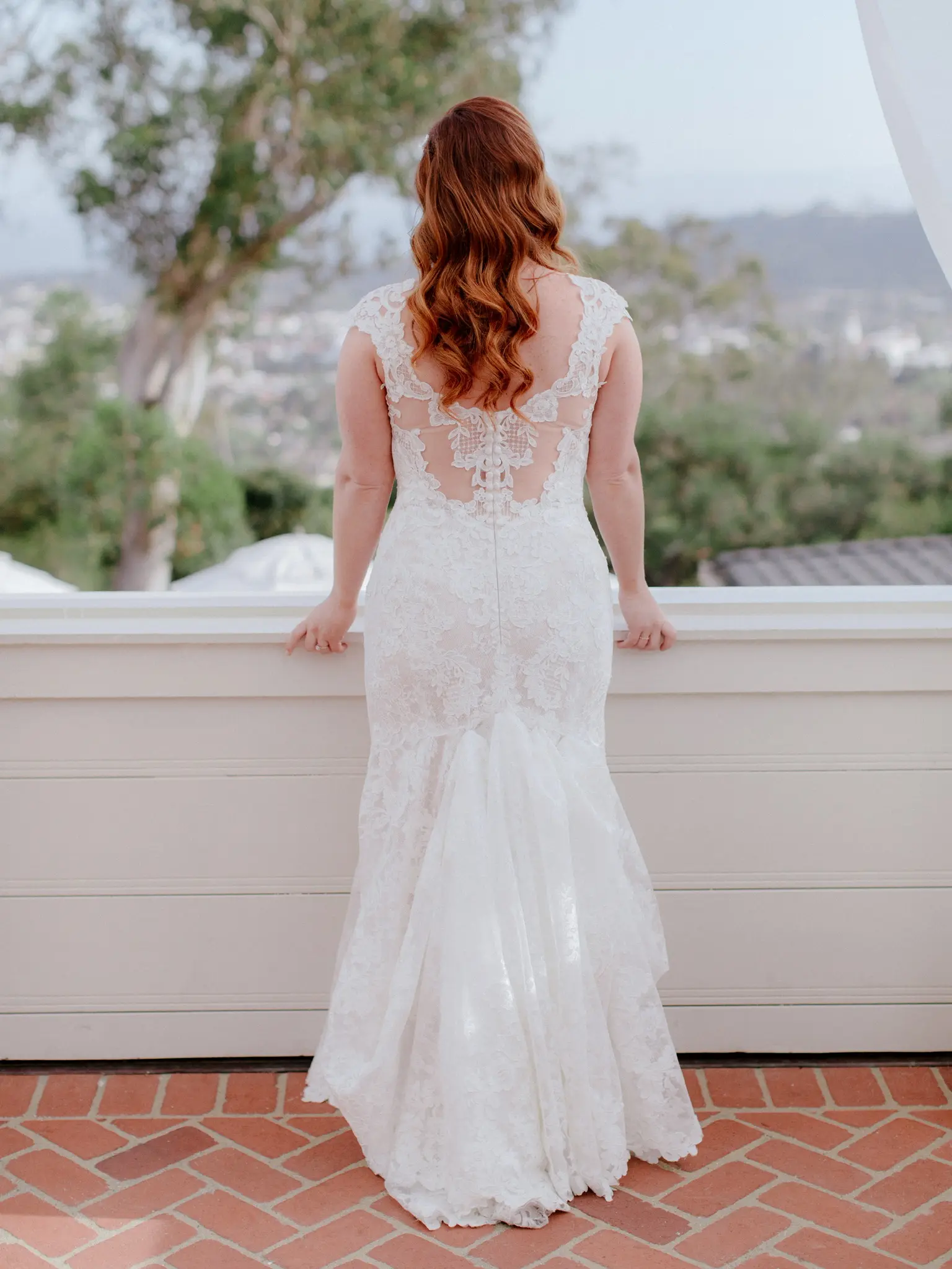 Bride wearing a sexy low back wedding dress