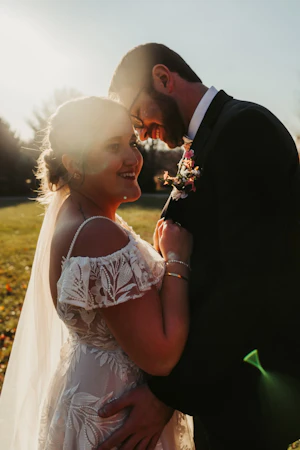 Bride wearing Keisha wedding dress by Maggie Sottero with her husband