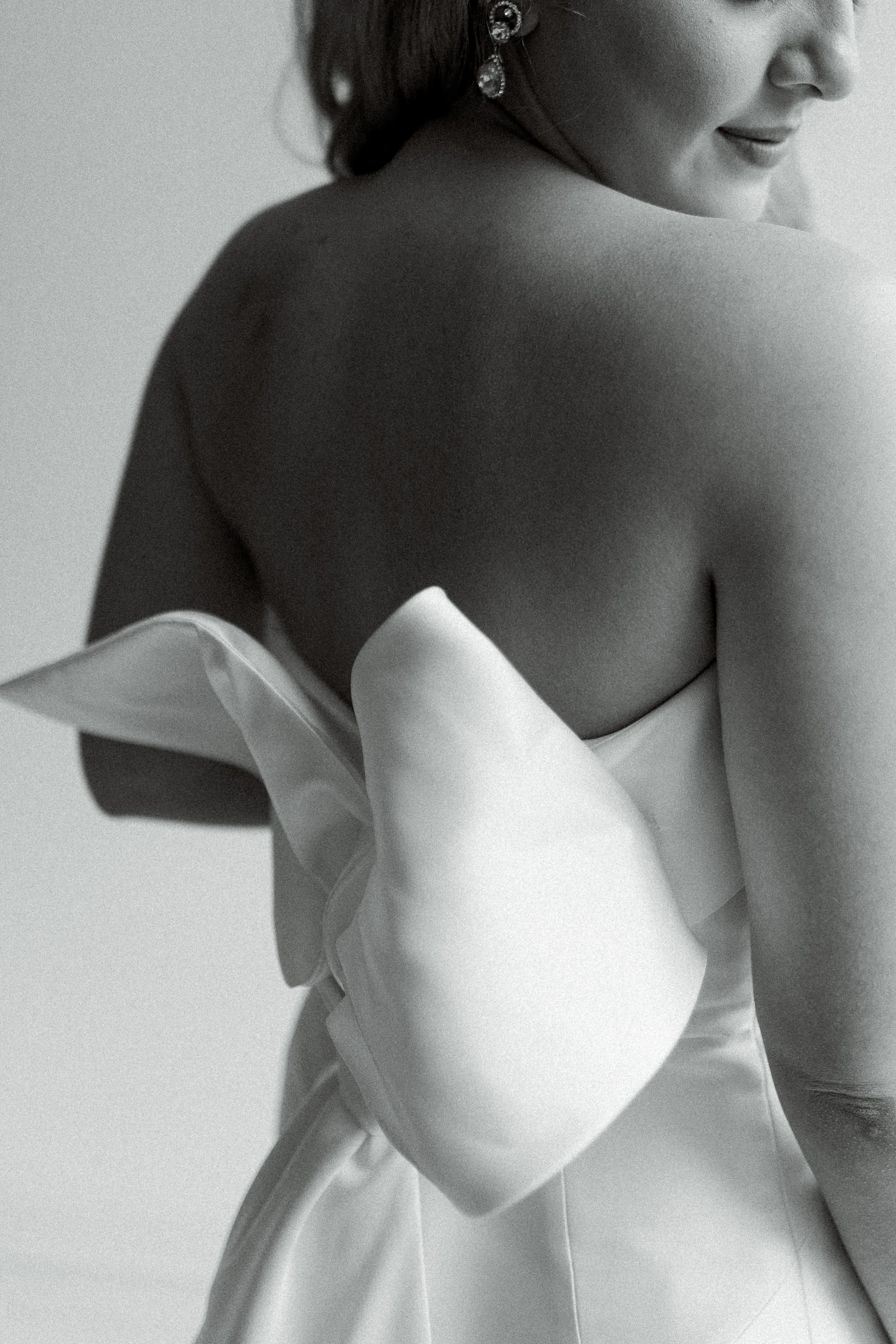 Black and White Photo of Bride From the Back Wearing Wedding Gown Called Mitchell by Maggie Sottero