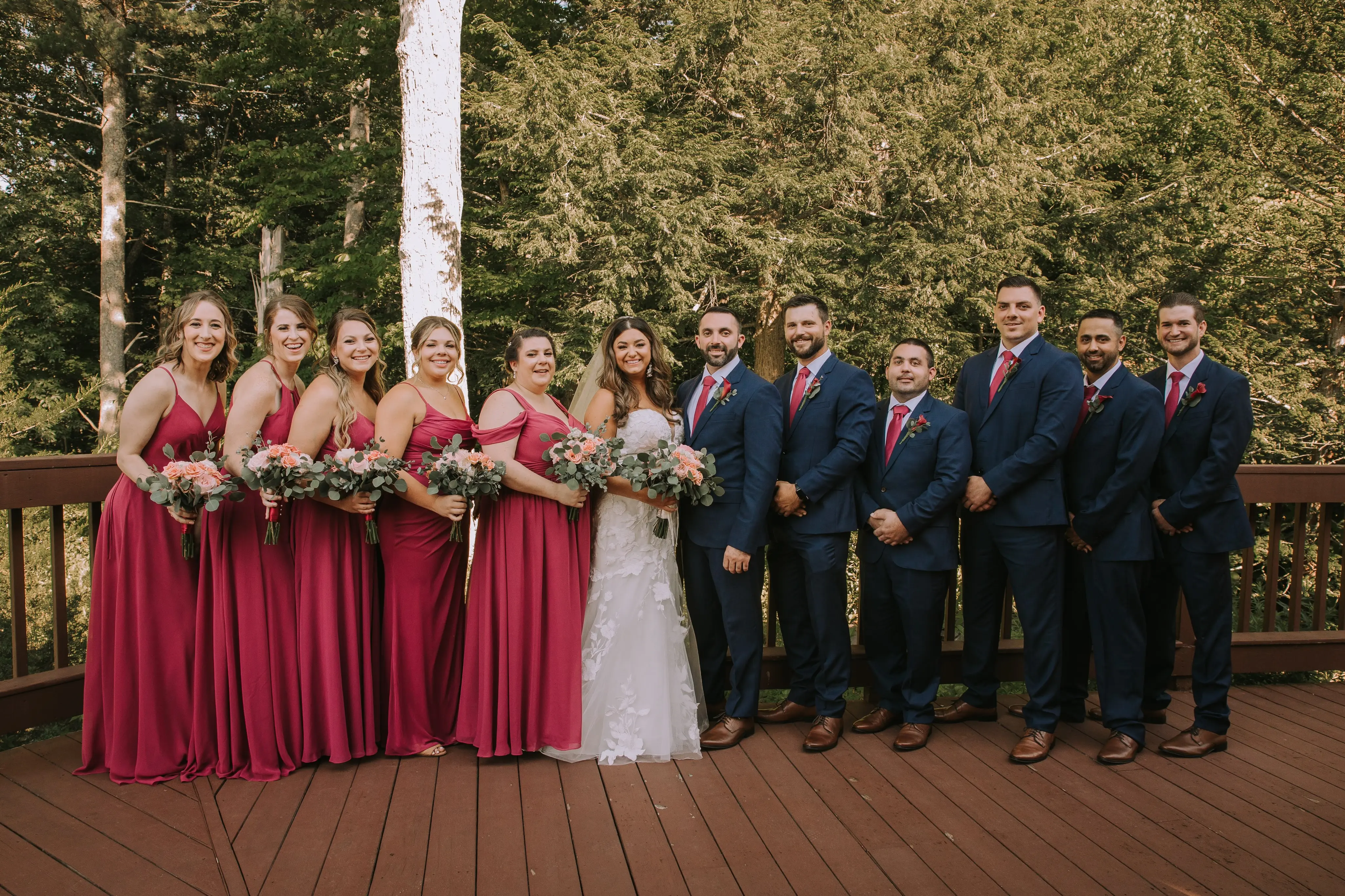 Bride Wearing Lace Mermaid Wedding Gown Called Hattie By Rebecca Ingram With Groom And Bridal Party