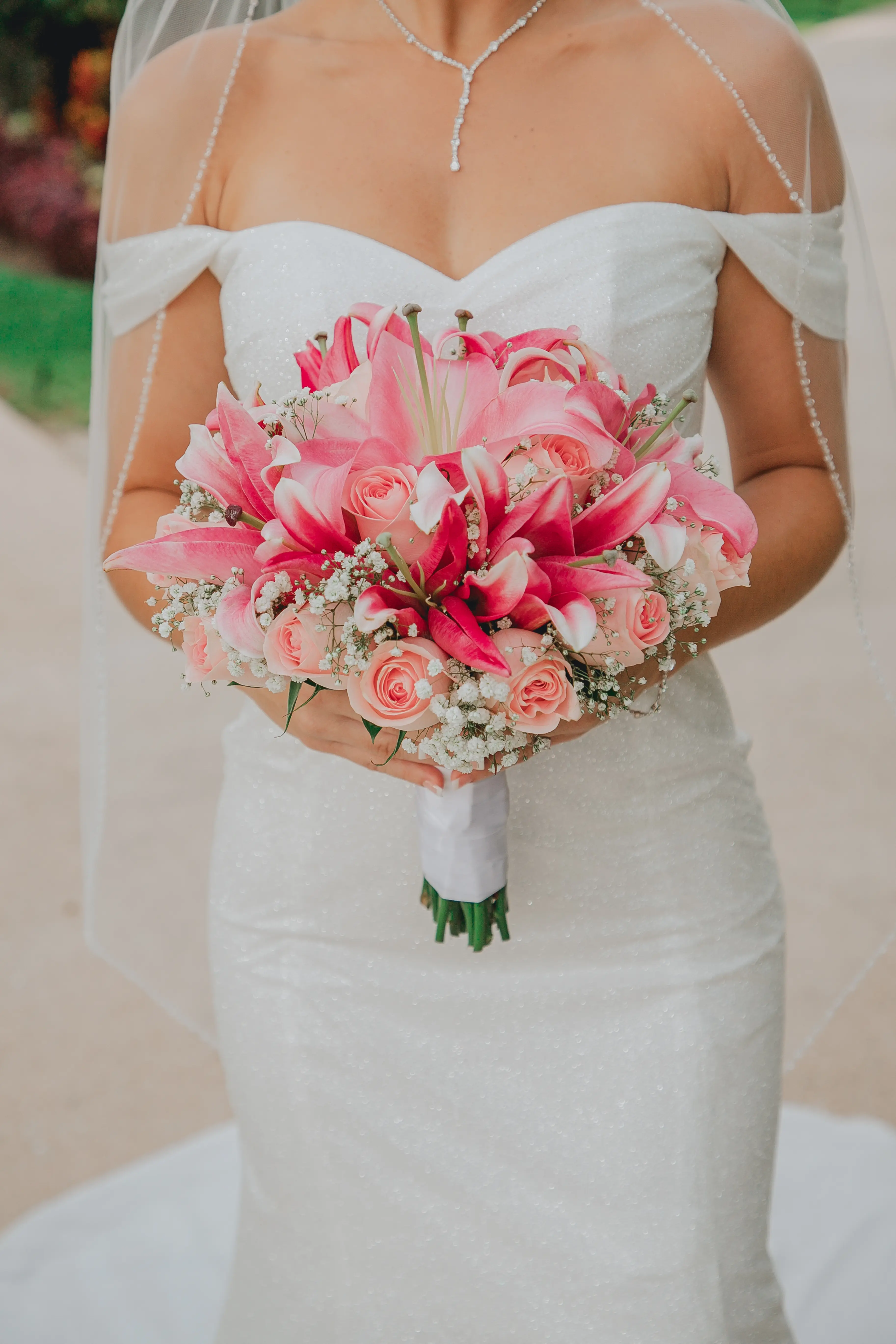 Bride Wearing Sparkly Fit And Flare Wedding Dress Called Anniston Lane By Maggie Sottero And Close Up Of Bouquet