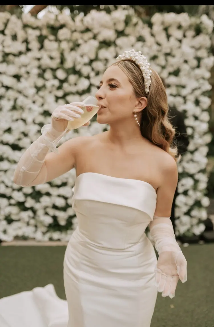 Bride Wearing Simple Sheath Satin Dress With Back Bow Mitchell By Maggie Sottero
