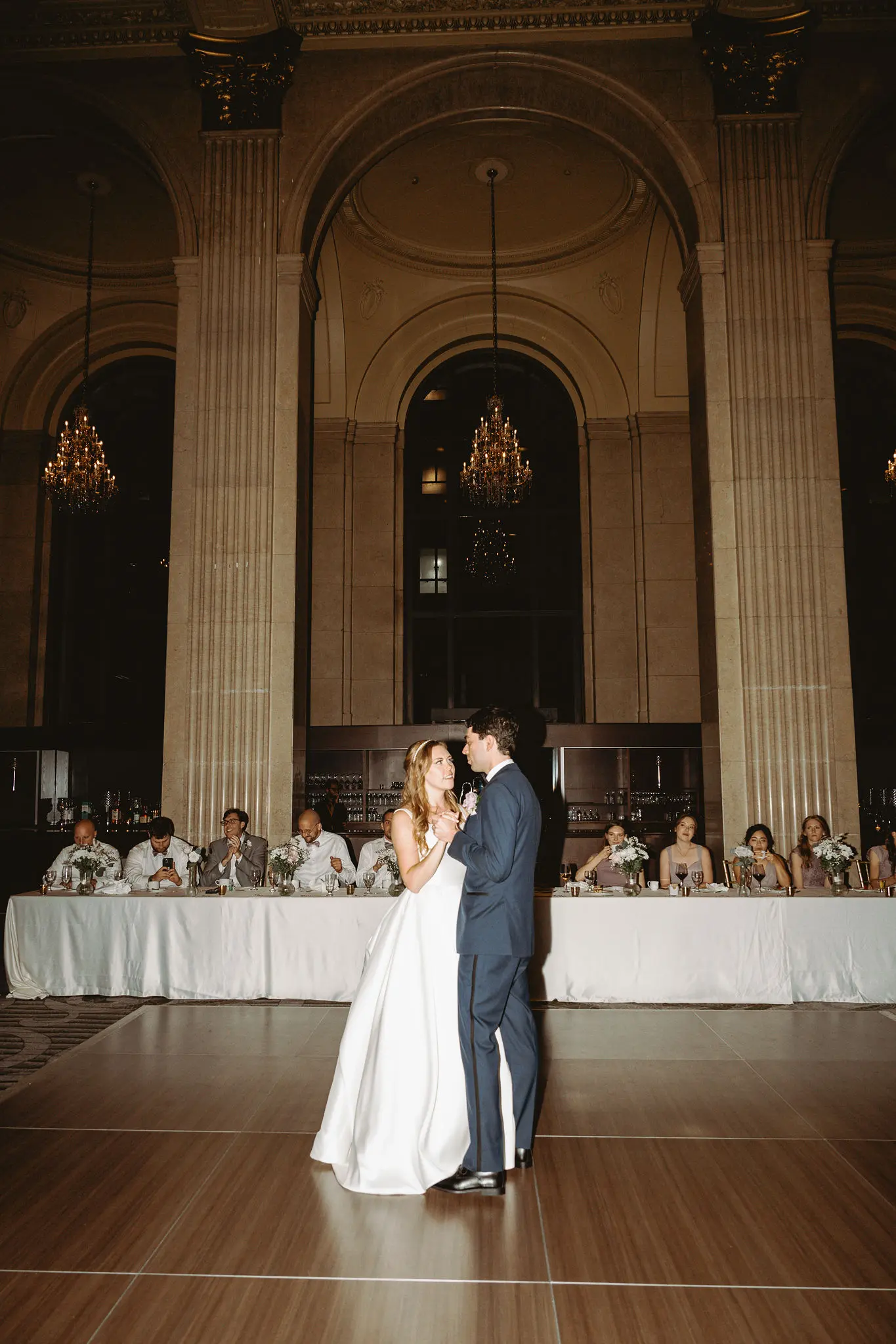 Bride wearing Selena wedding gown by Maggie Sottero dancing with her husband