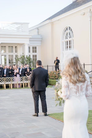 Bride wearing Dionne wedding dress by Rebecca Ingram doing first look with her husband
