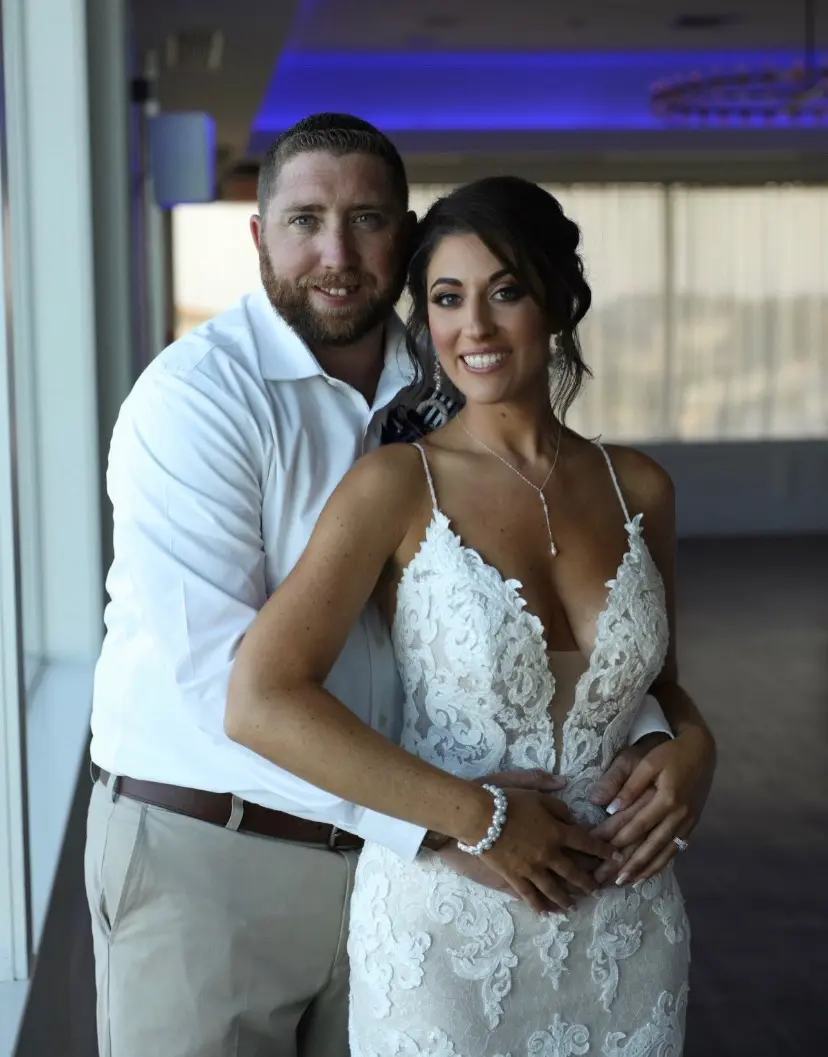 Groom With Bride Wearing Lace Sheath Wedding Dress Tuscany Lynette By Maggie Sottero