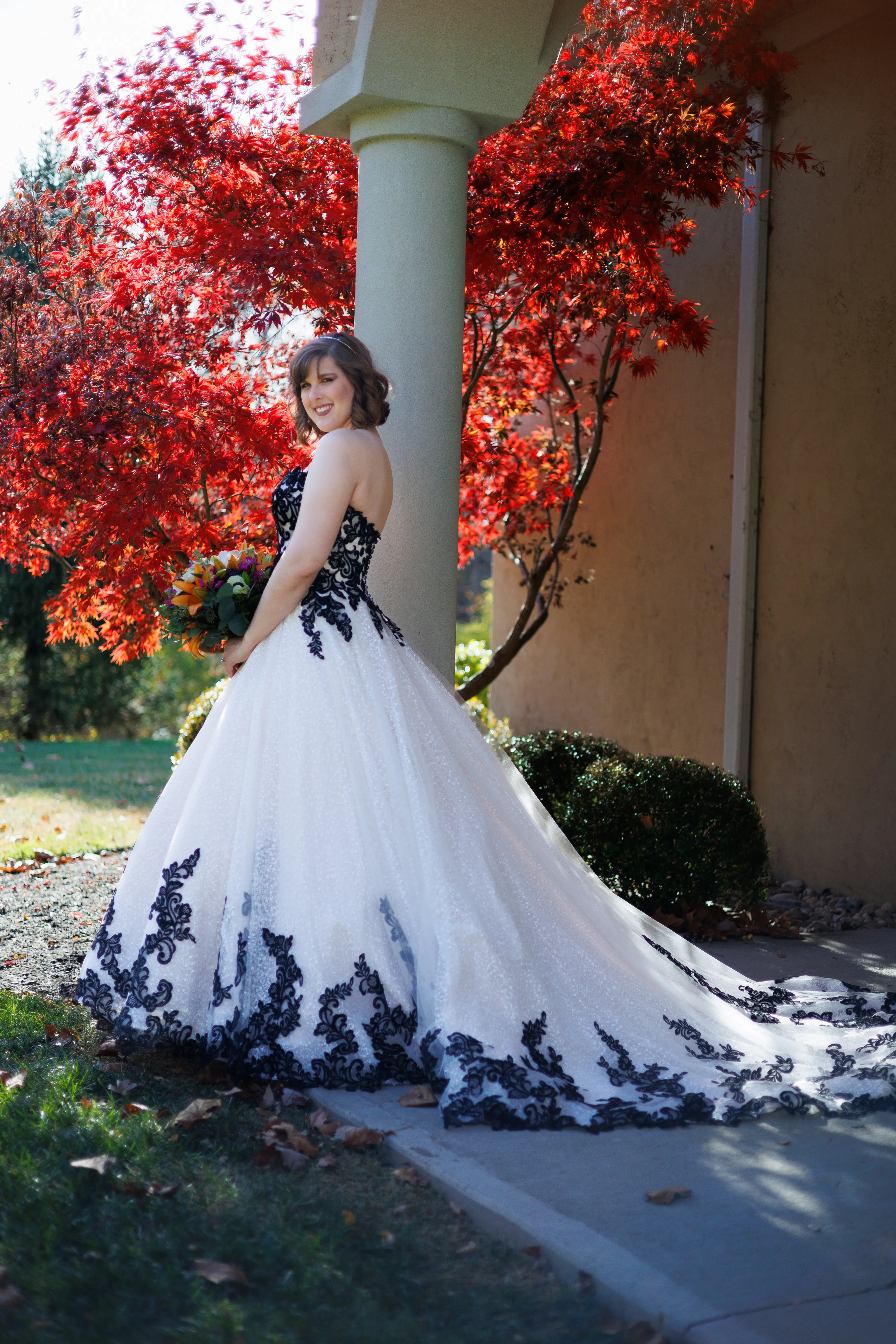 Bride Wearing Black And White Lace Strapless Ball Gown Called Tristyn By Maggie Sottero