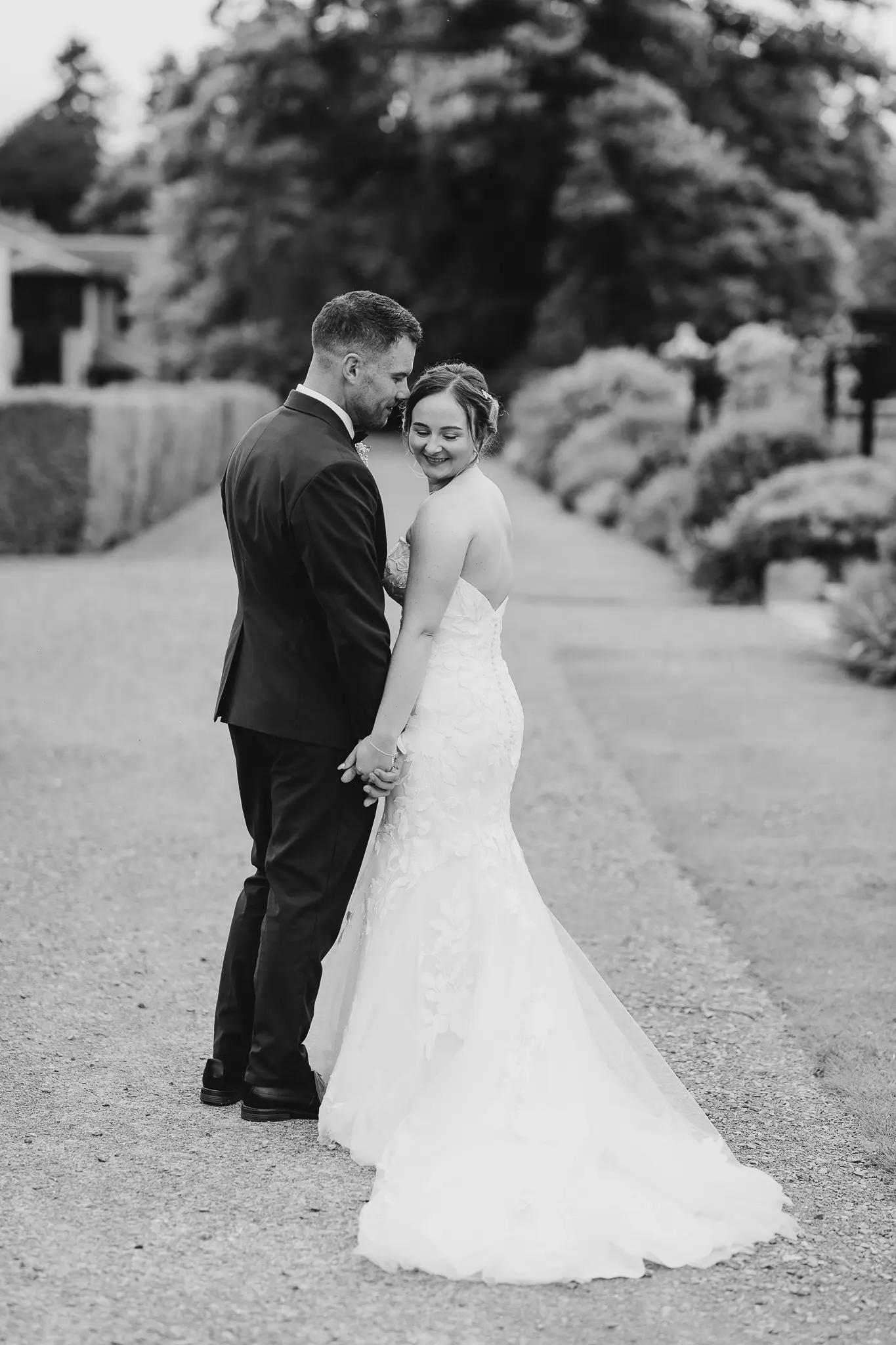 Groom With Bride Wearing Strapless Mermaid Wedding Dress With Oversized Lace Hattie By Rebecca Ingram