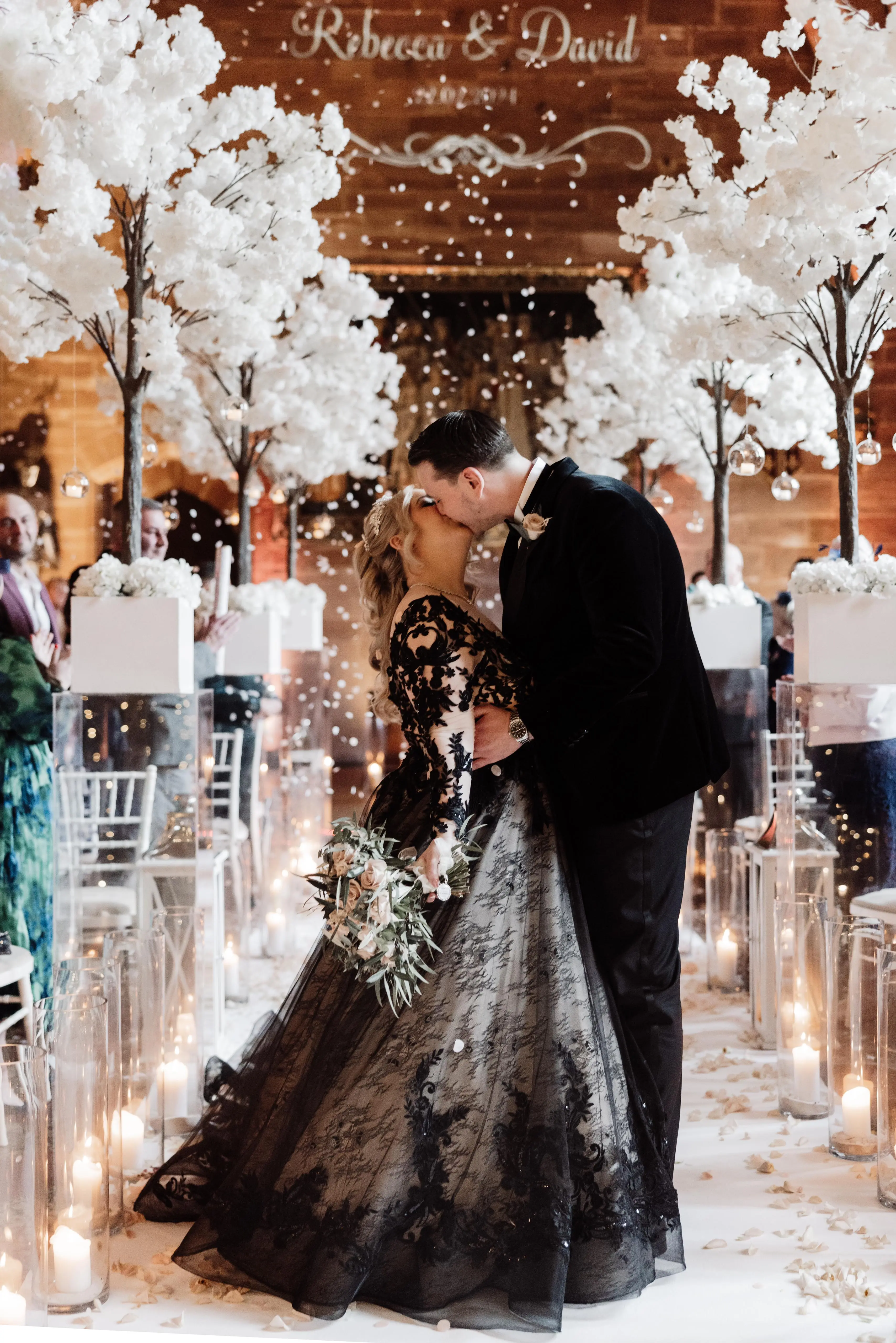 Bride Wearing Black Lace Ballgown Wedding Dress Called Zander By Sottero And Midgley Kissing Groom