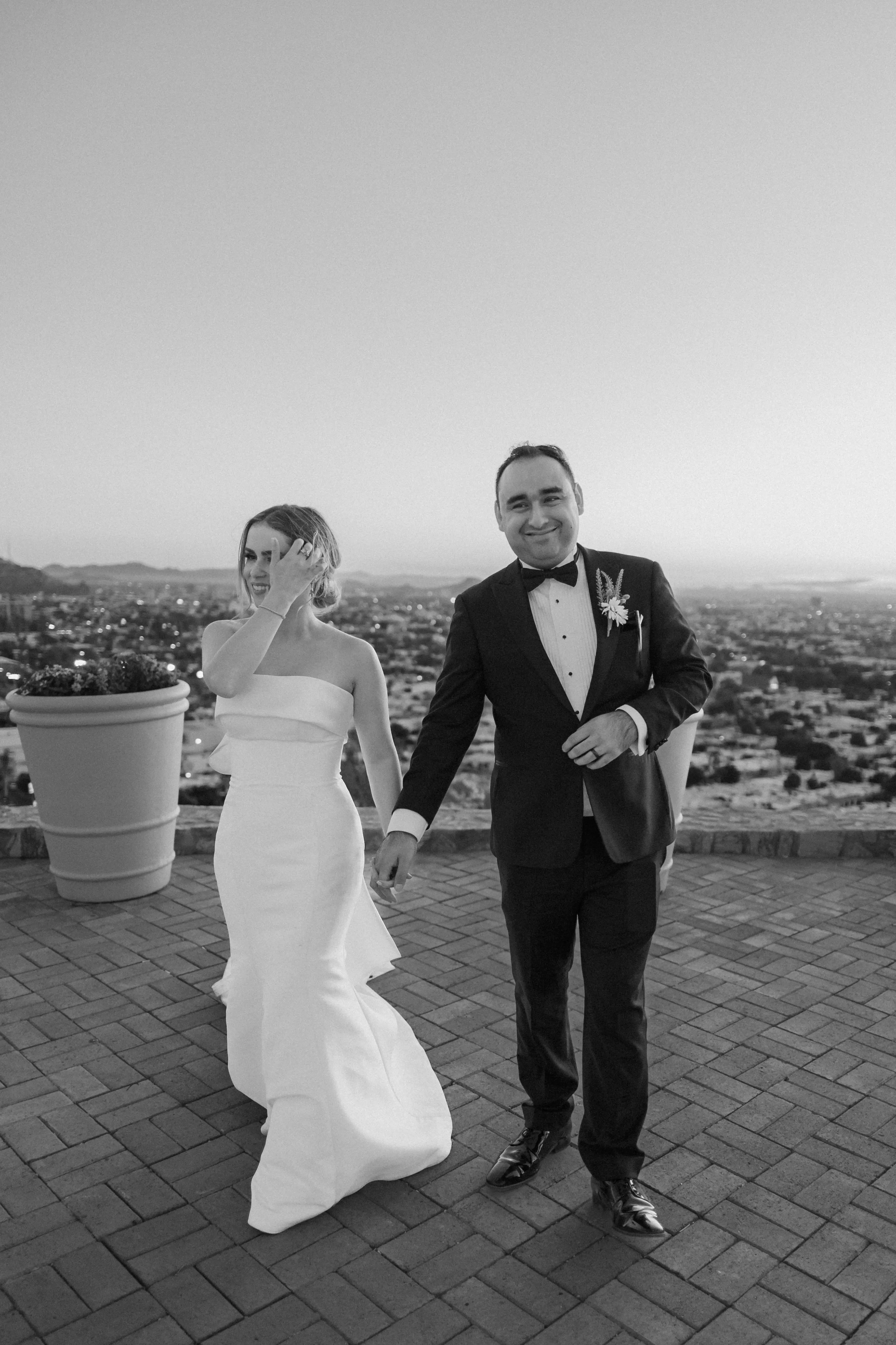 Bride In Modern Strapless Wedding Dress Called Mitchell By Maggie Sottero With Groom