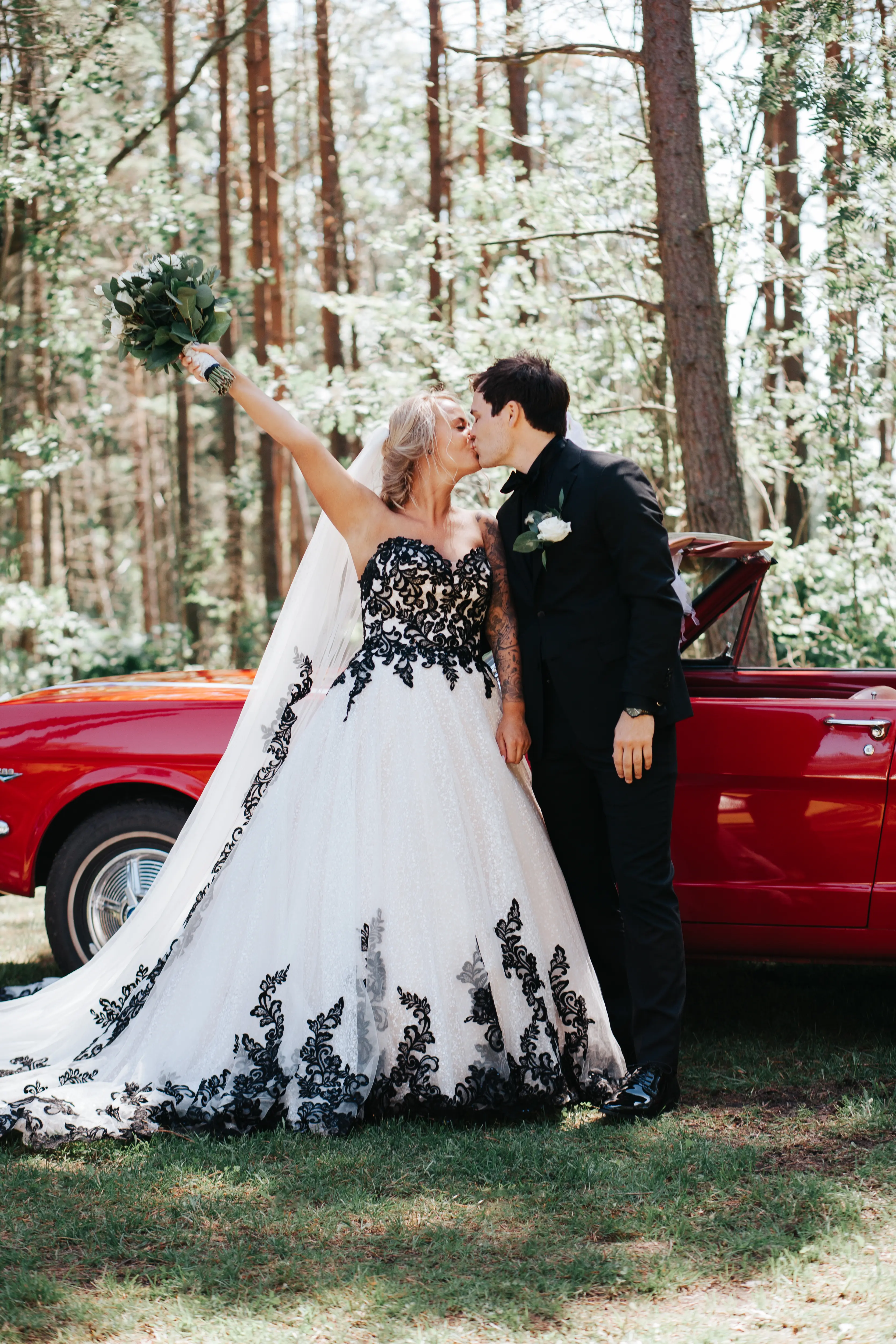 Groom With Bride Wearing Ballgown With Black Lace Detail Called Tristyn By Maggie Sottero