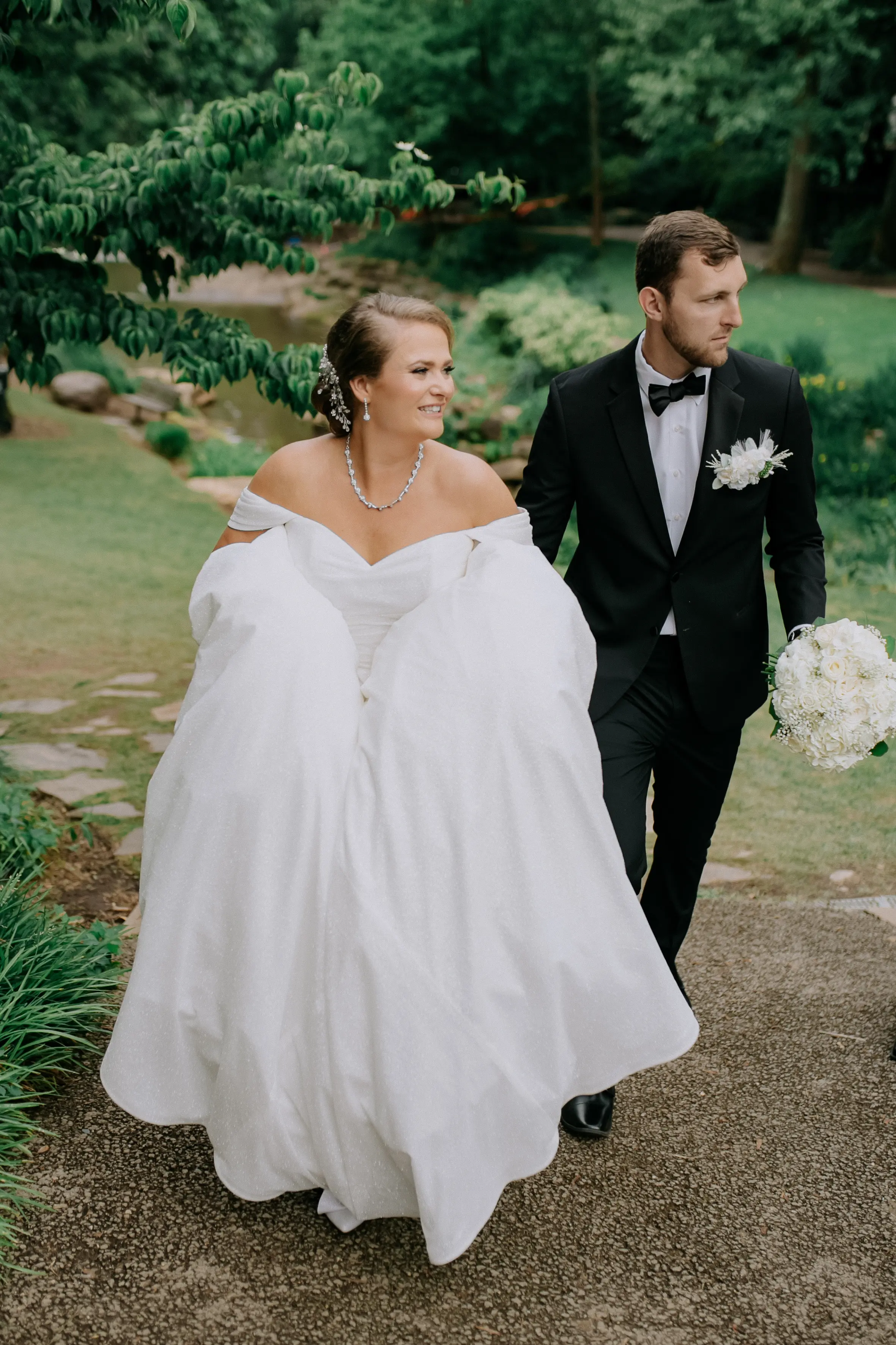 Bride wearing Anniston by Maggie Sottero walking with her husband