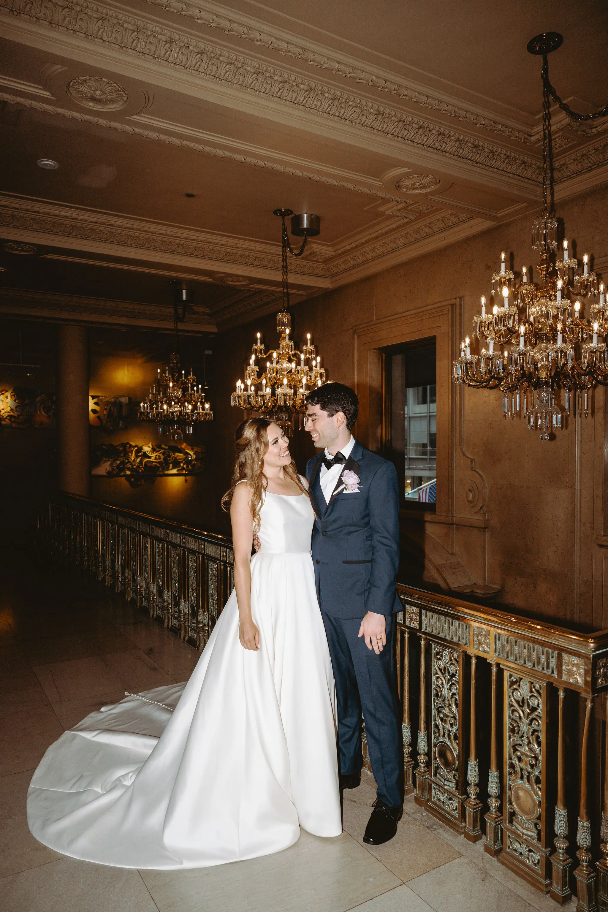 Bride wearing Selena wedding gown by Maggie Sottero smiling at her husband