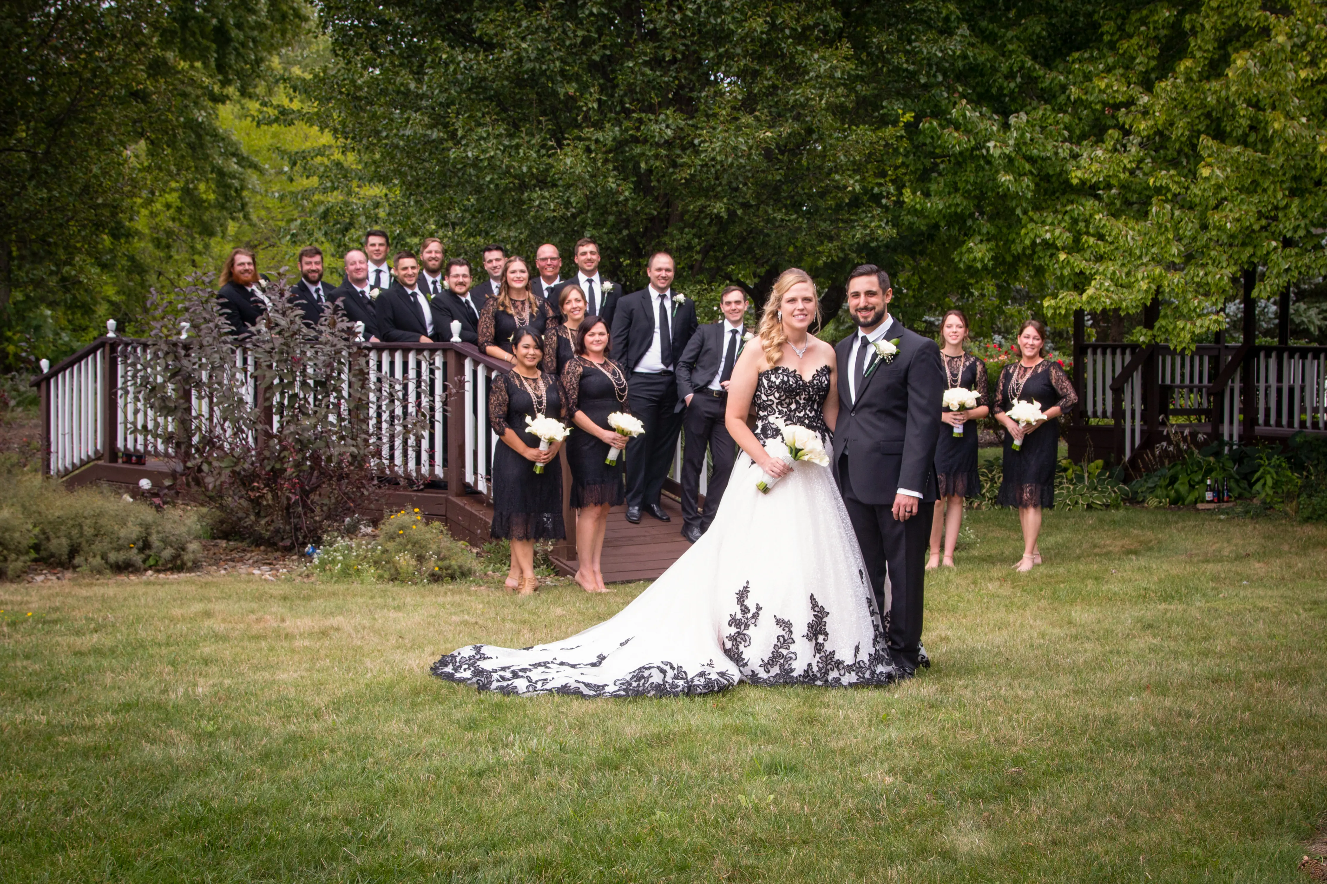 Bride Wearing A-Line Black Lace Wedding Dress Called Tristyn By Maggie Sottero With The Wedding Party