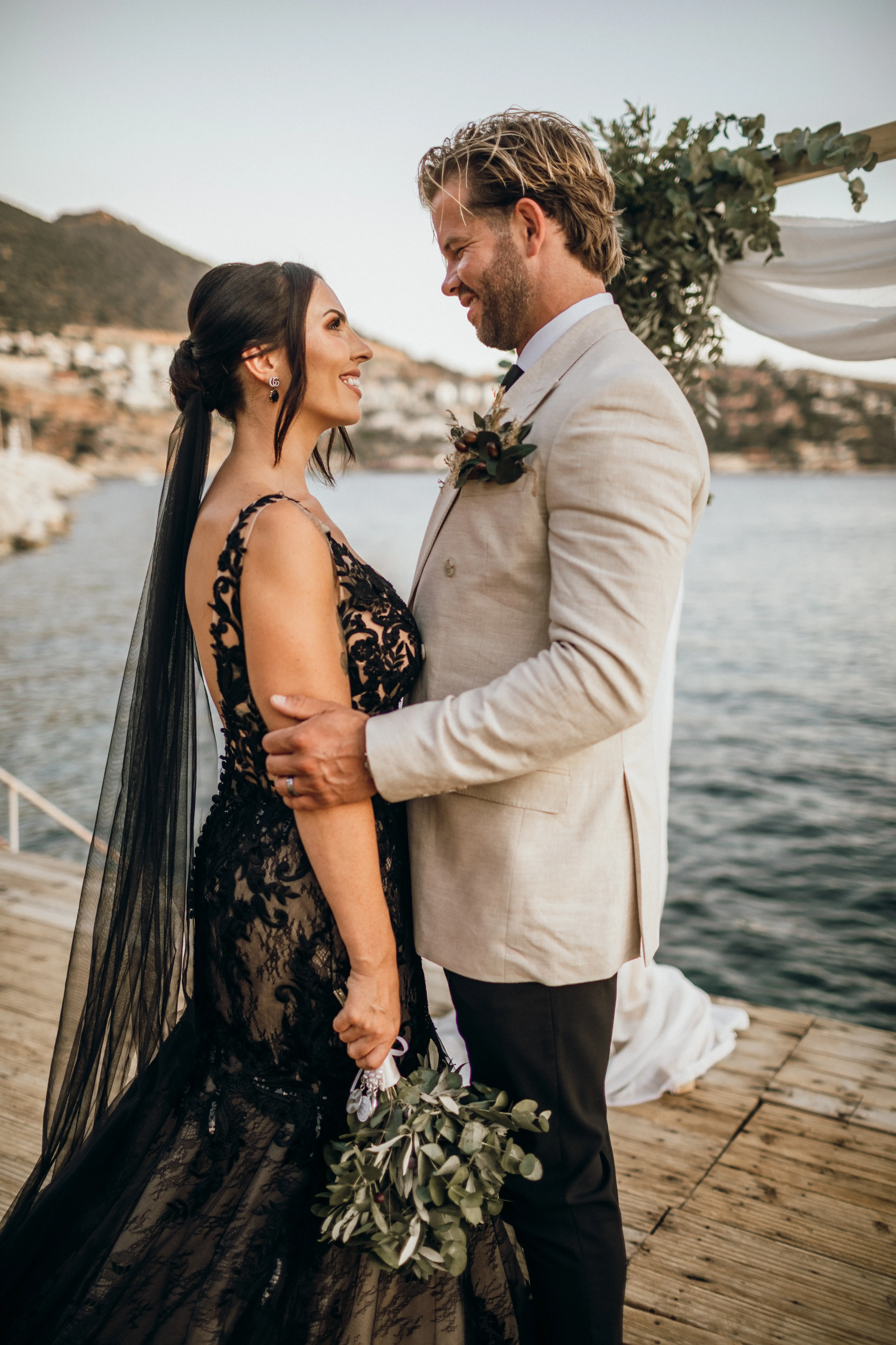 Bride Wearing Black Fit And Flare Wedding Dress Called Zander Lane By Sottero And Midgley Looking At The Groom