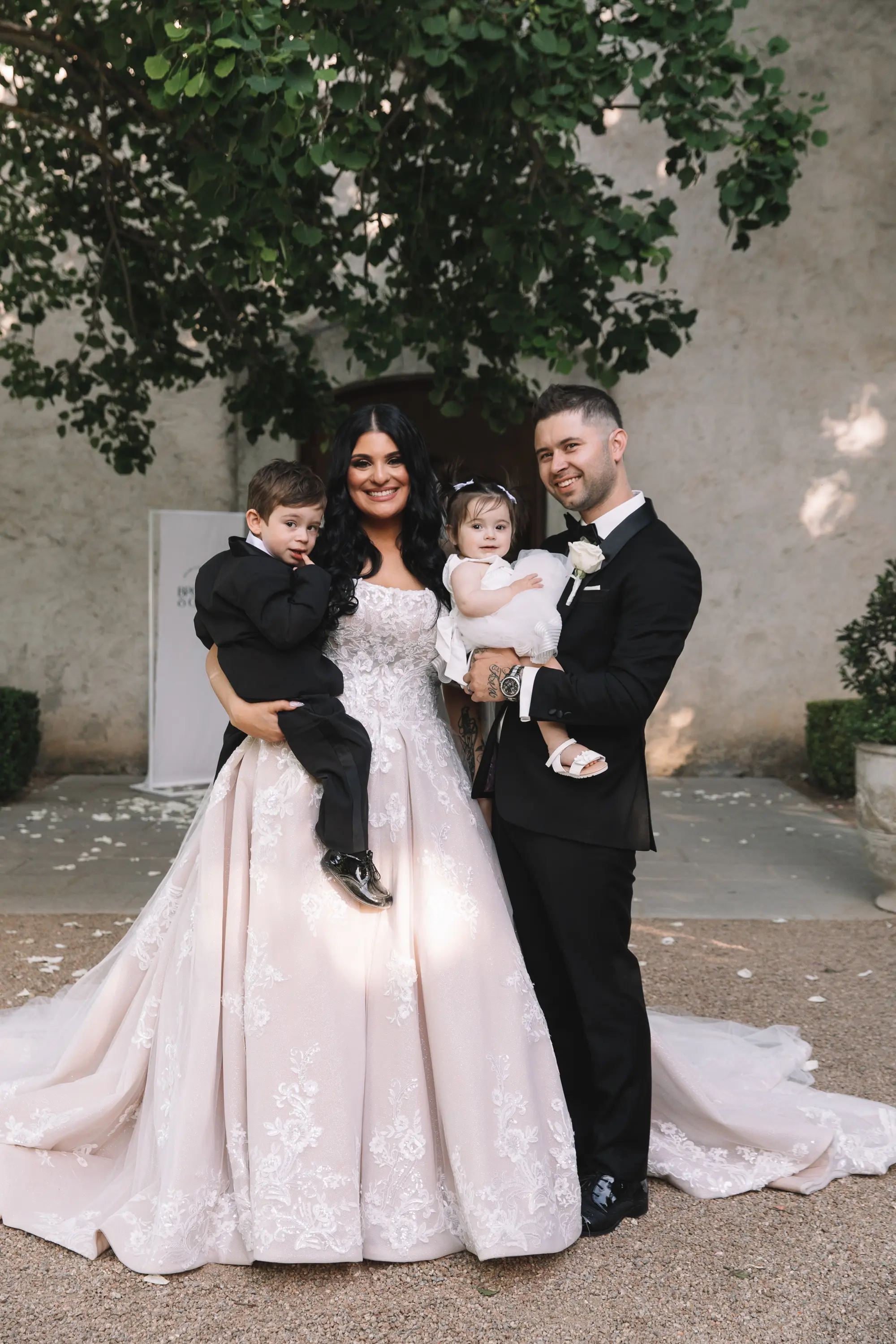 Bride Wearing Princess Wedding Dress Called Norvinia By Sottero And Midgley And Groom With Their Two Kids
