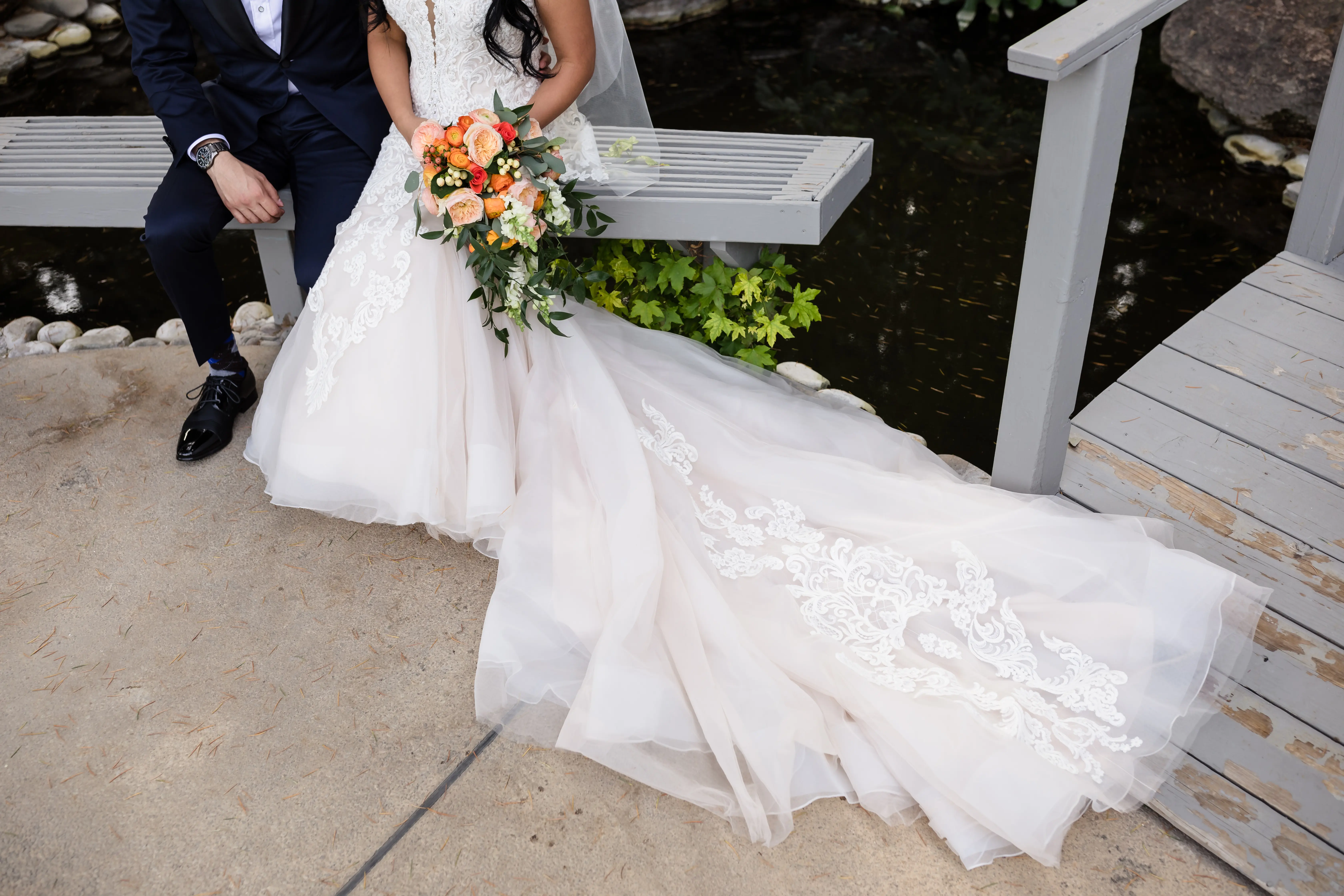 Bride Wearing Lace Fit and Flare Wedding Dress by Maggie Sottero Bride and Groom Sitting