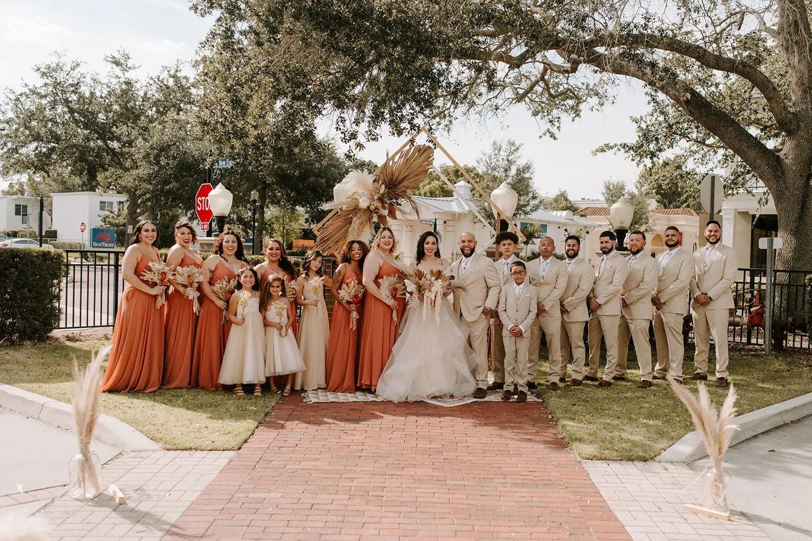 Bride with wedding party wearing strapless tulle ballgown wedding dress