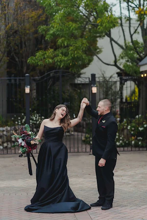 Bride wearing Aspen wedding dress by Sottero and Midgley being spun by her husband
