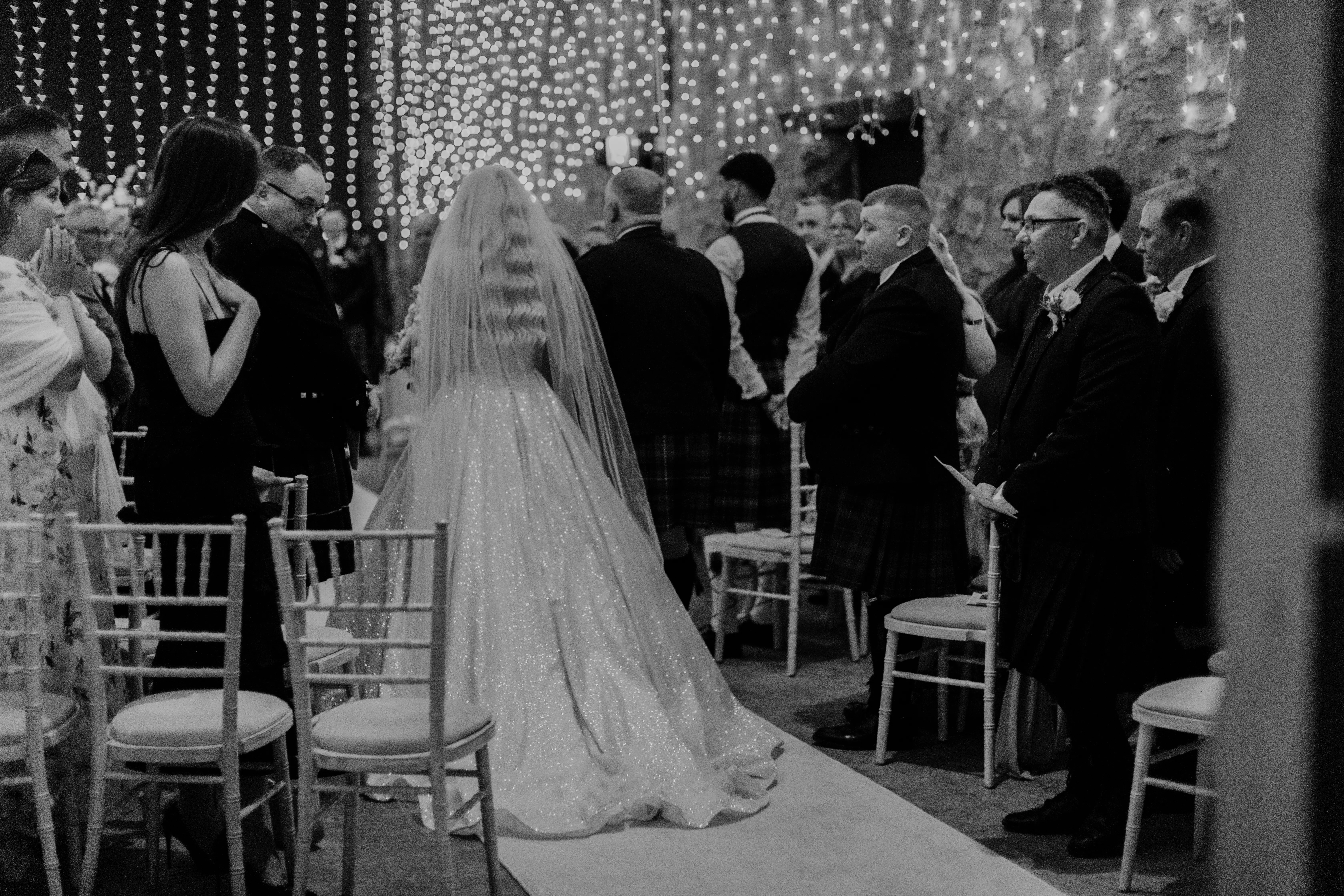 Bride Wearing Sparkly Aline Wedding Dress Called Anniston Walking Down The Aisle With Her Dad