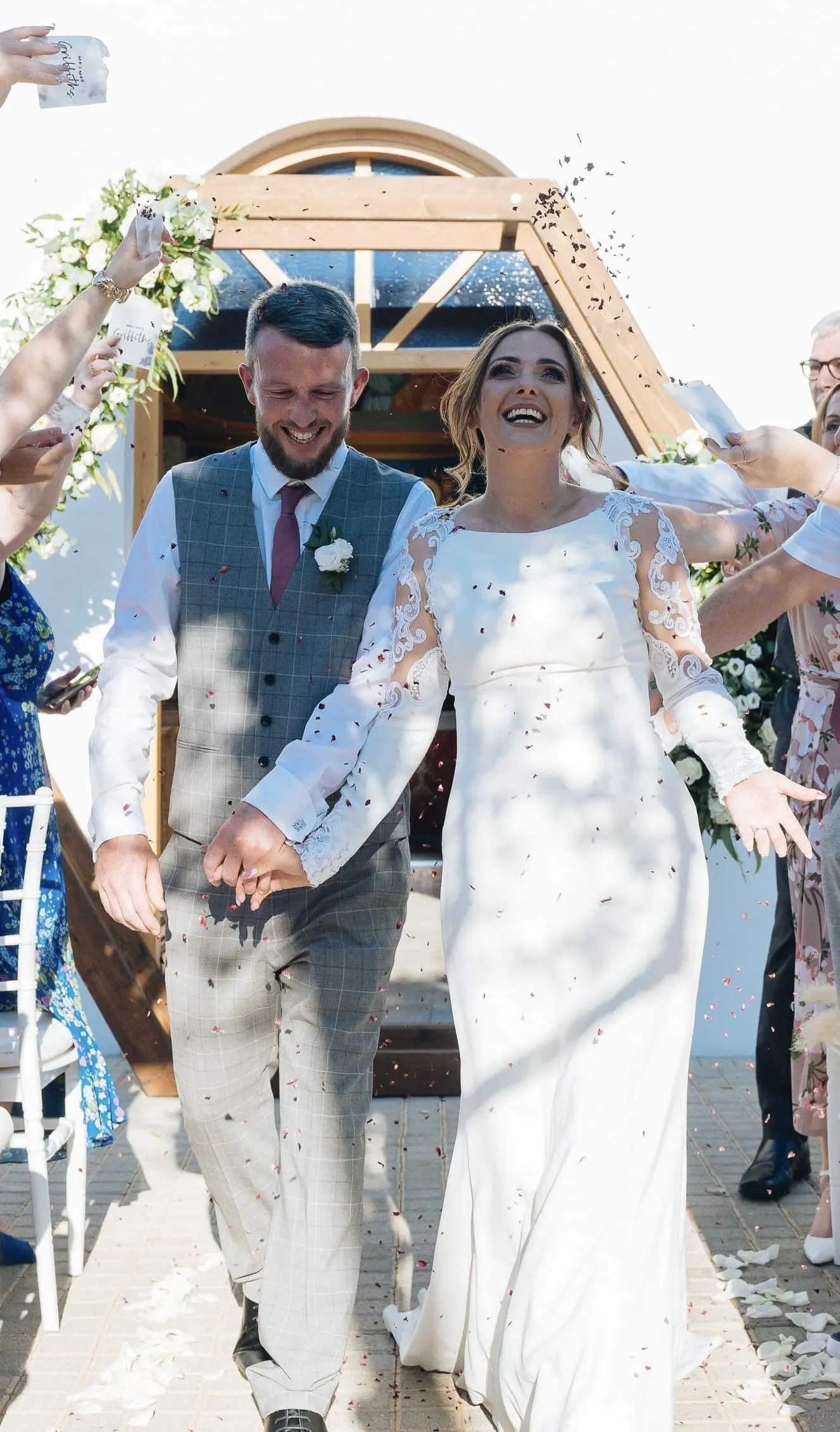 Groom with Real Bride in Minimalist Crepe Long Sleeve Lace Sheath Wedding Dress Called Bethany by Rebecca Ingram