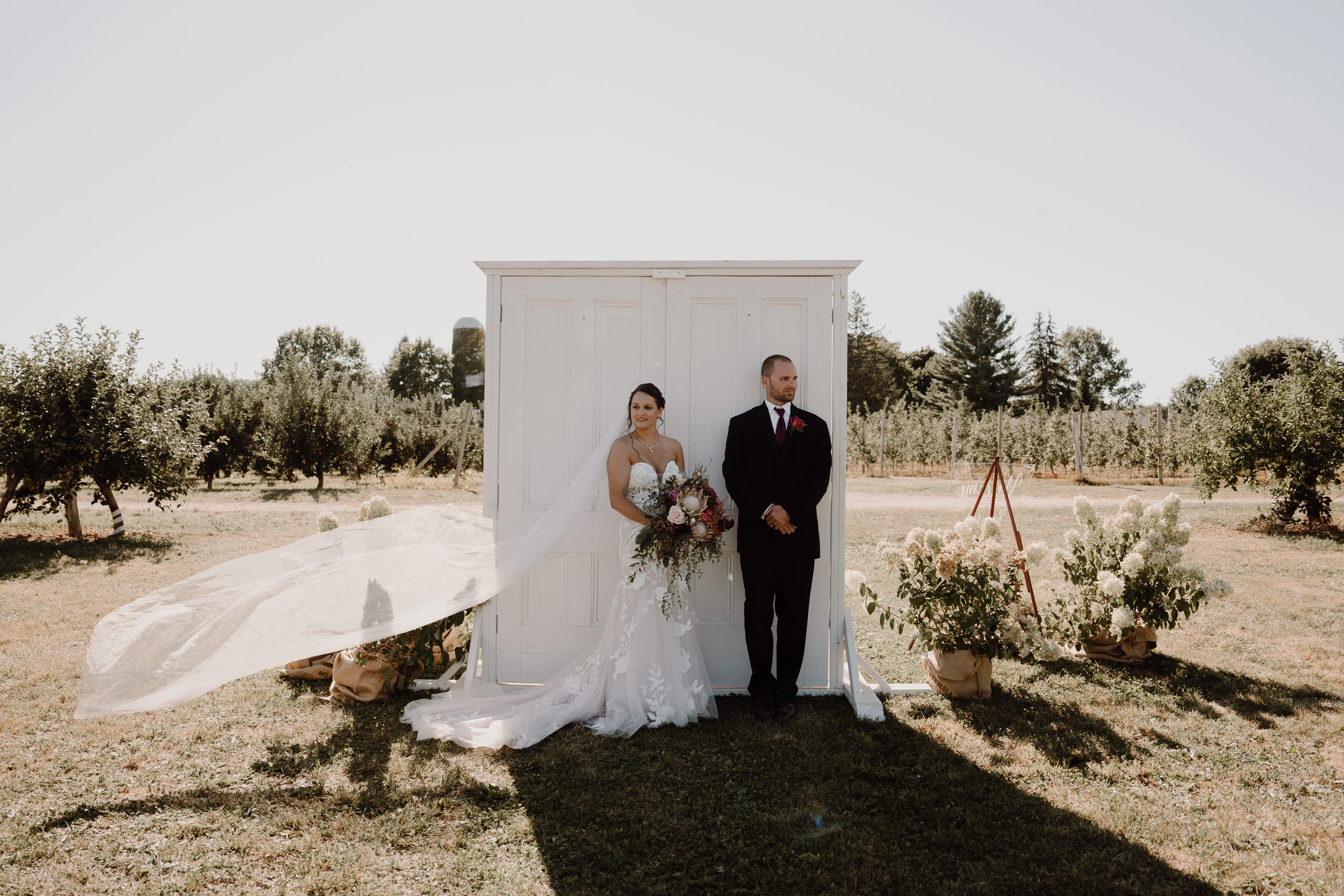 Groom With Bride Wearing Mermaid Wedding Dress With Oversized Lace Hattie By Rebecca Ingram