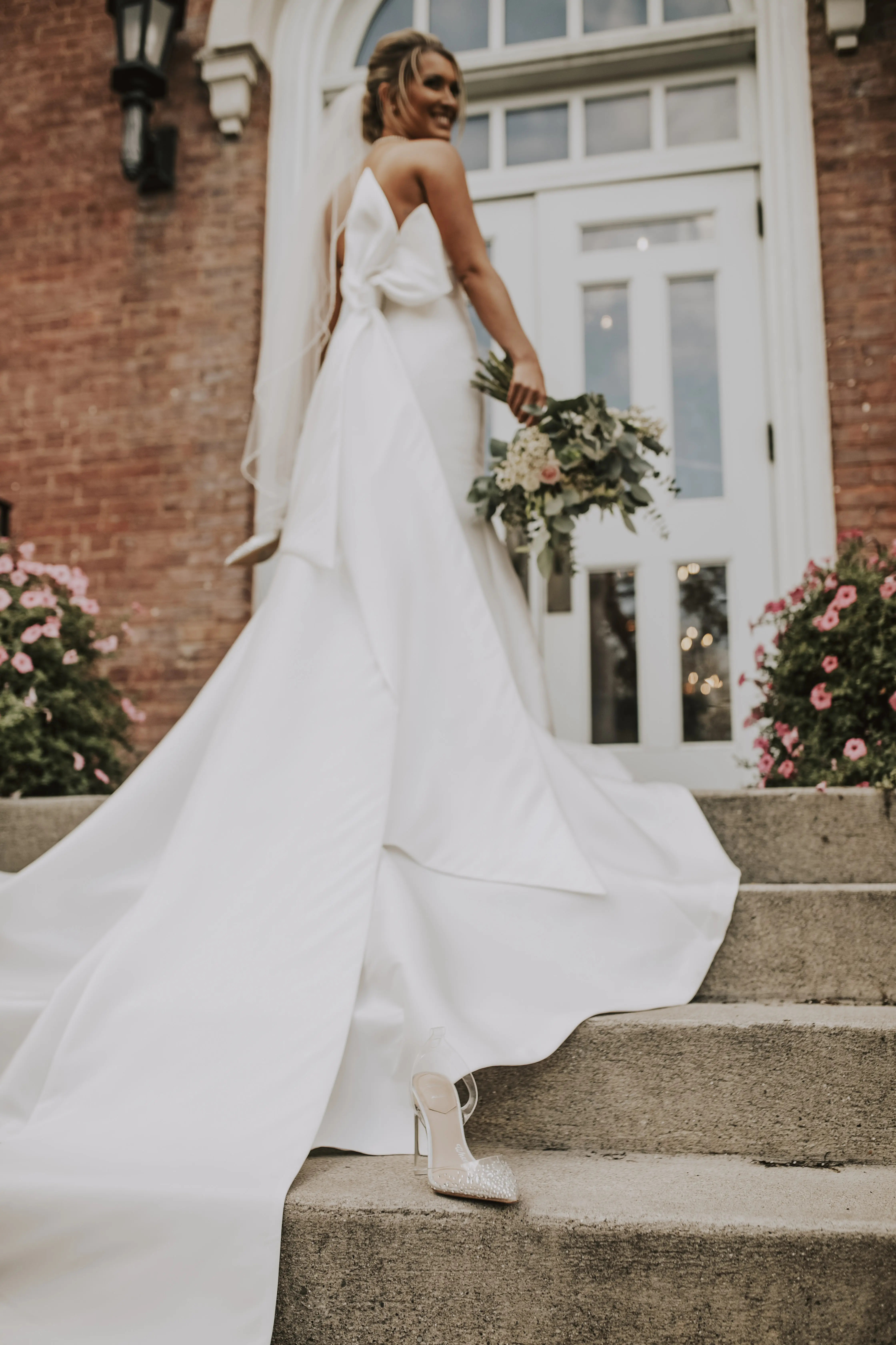 Bride wearing Mitchell wedding dress by Maggie Sottero loses a shoe