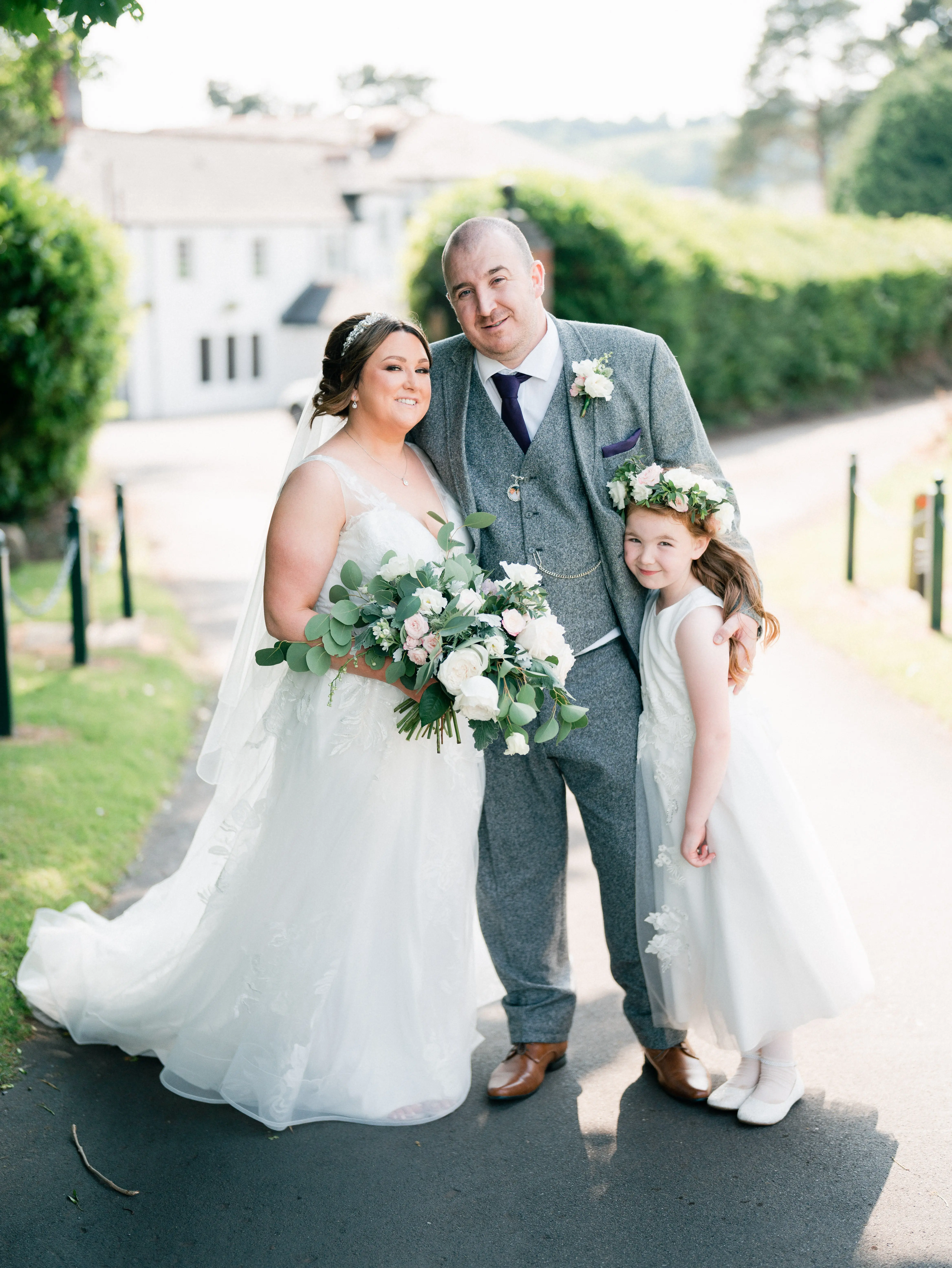 Real Bride in A-Line Wedding Gown with Lace Motifs Over Tulle and Beaded Lace Bodice Embellished with Swarovski Crystals Called Priscilla by Rebecca Ingram