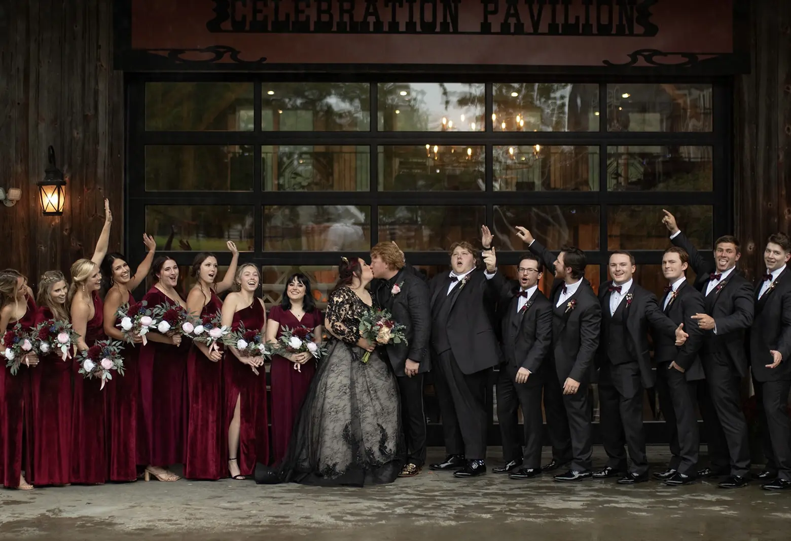 Bride In Black Wedding Dress Called Zander By Sottero And Midgely With Groom And Bridesmaids In Red Velvet