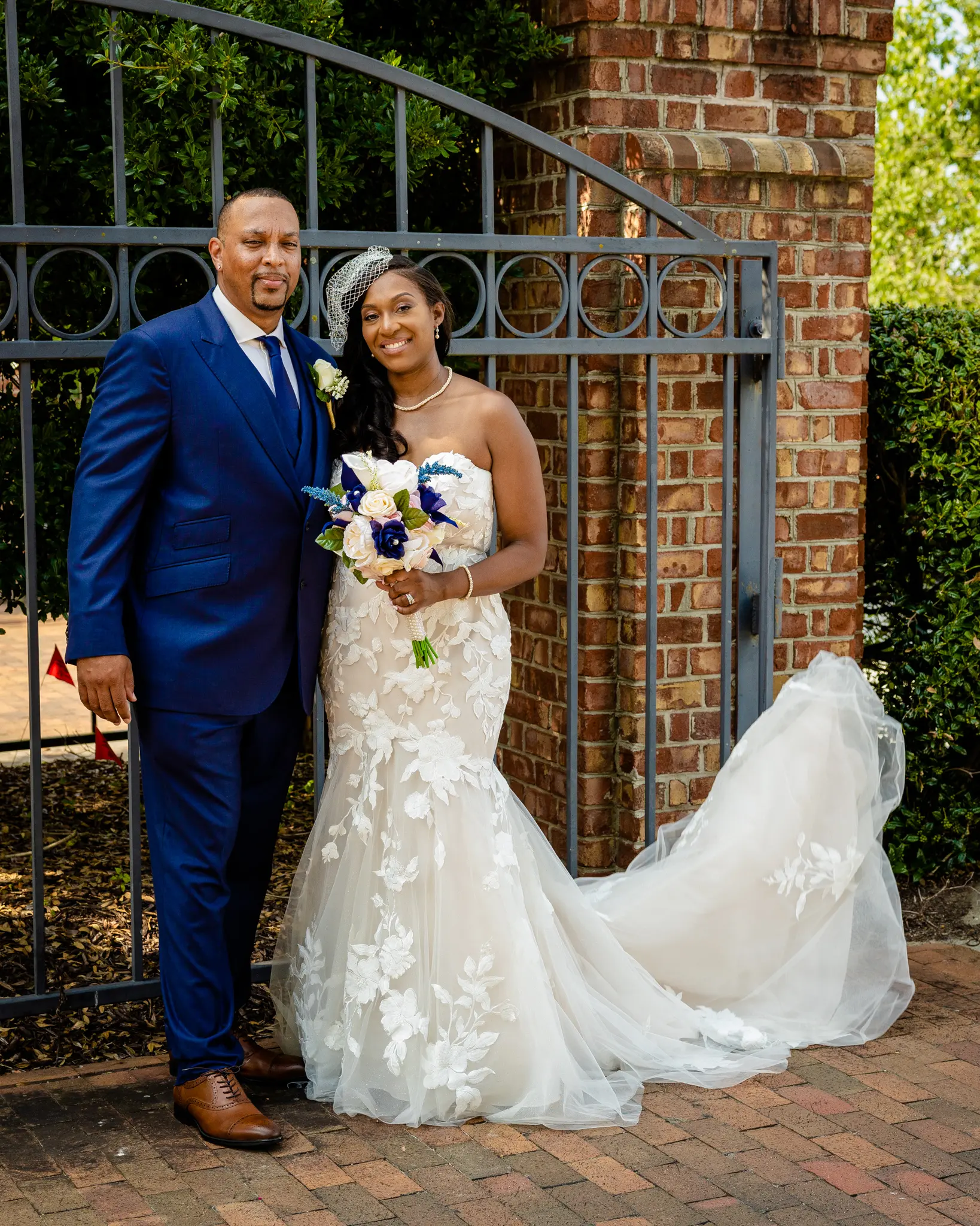 Groom With Bride Wearing Strapless Mermaid Wedding Dress With Oversized Lace Hattie By Rebecca Ingram