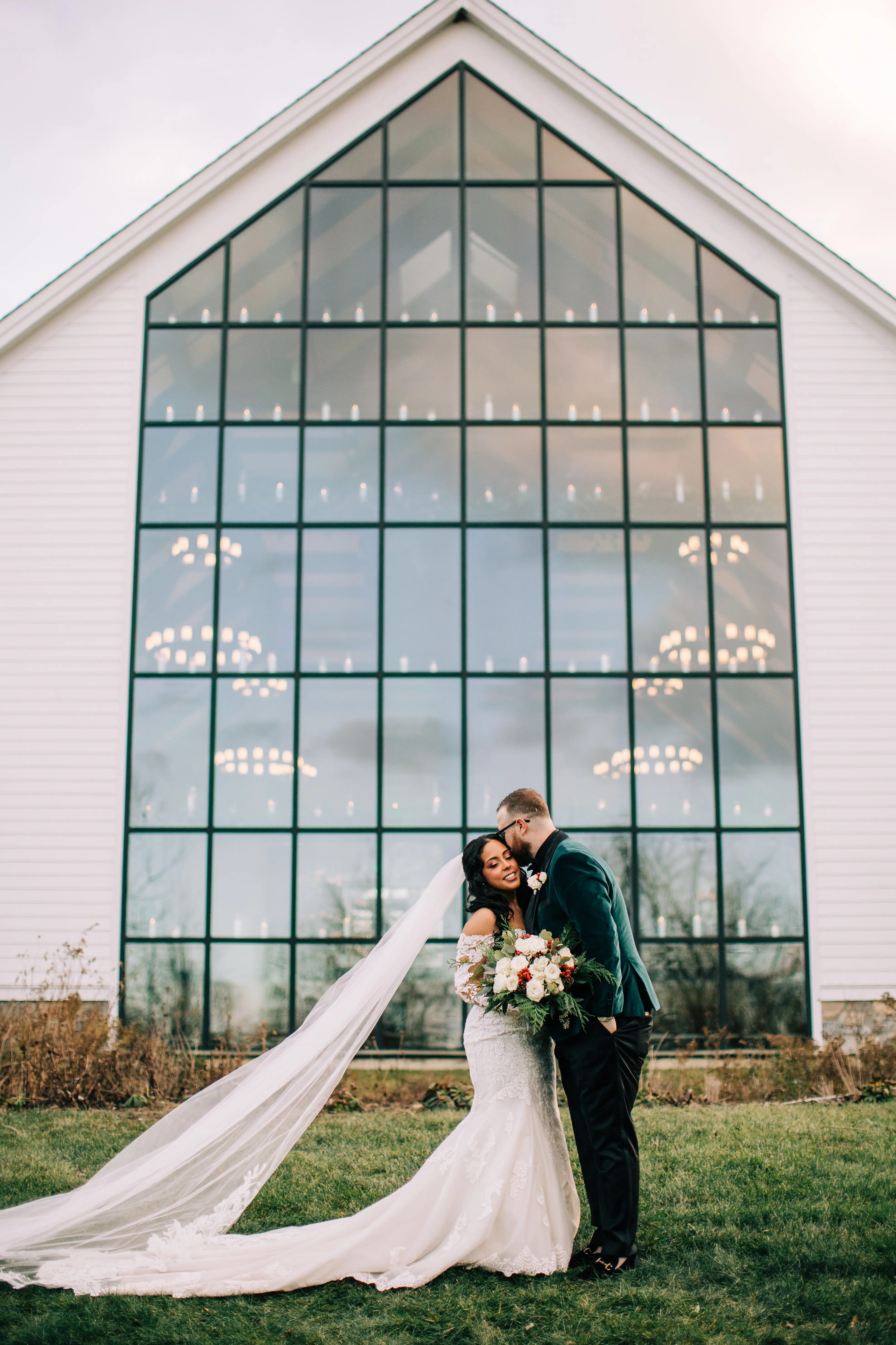 Bride Wearing Sexy Lace Wedding Dress Called Fiona By Maggie Sottero Next To A Large Window