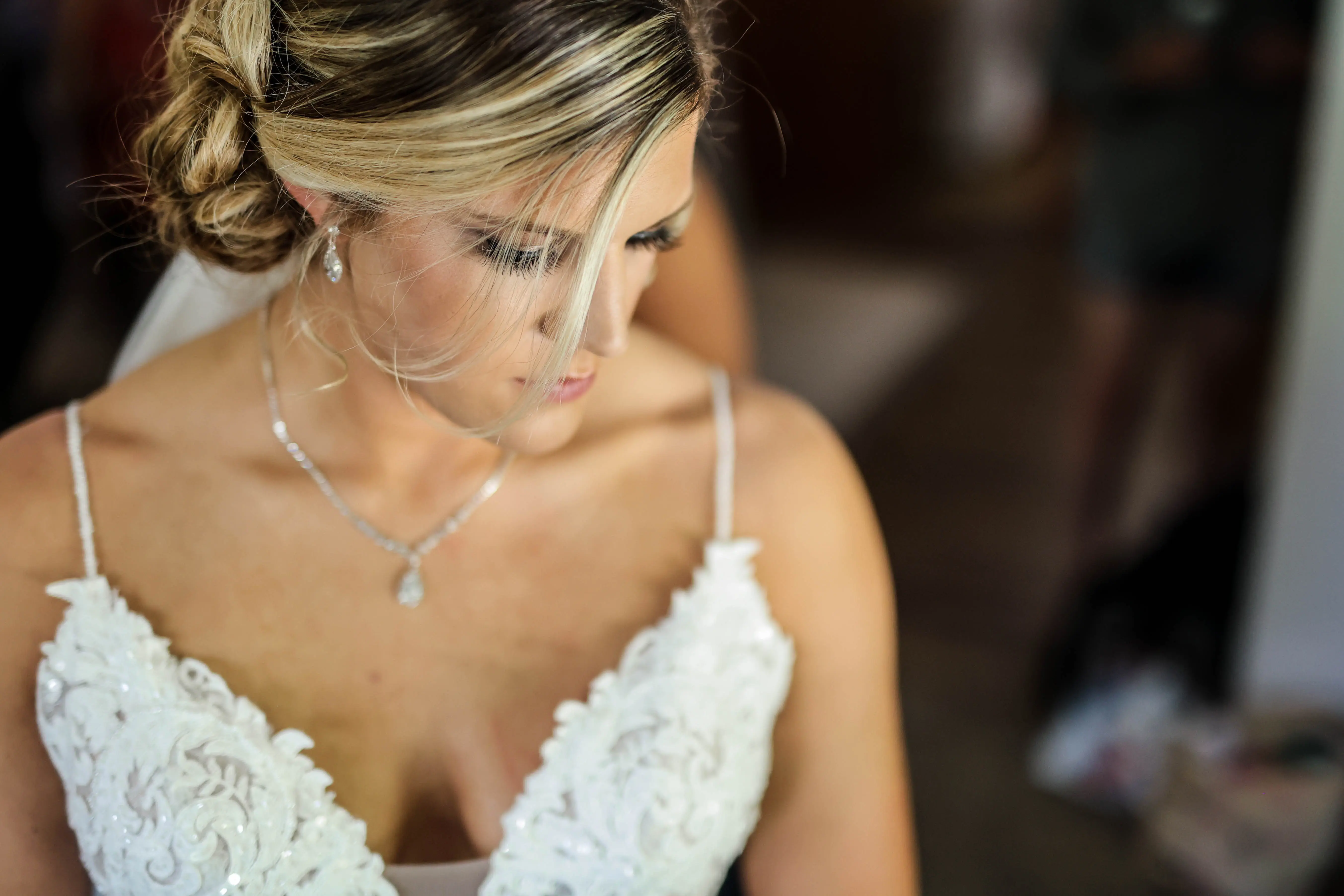 Bride wearing romantic lace sheath wedding dress