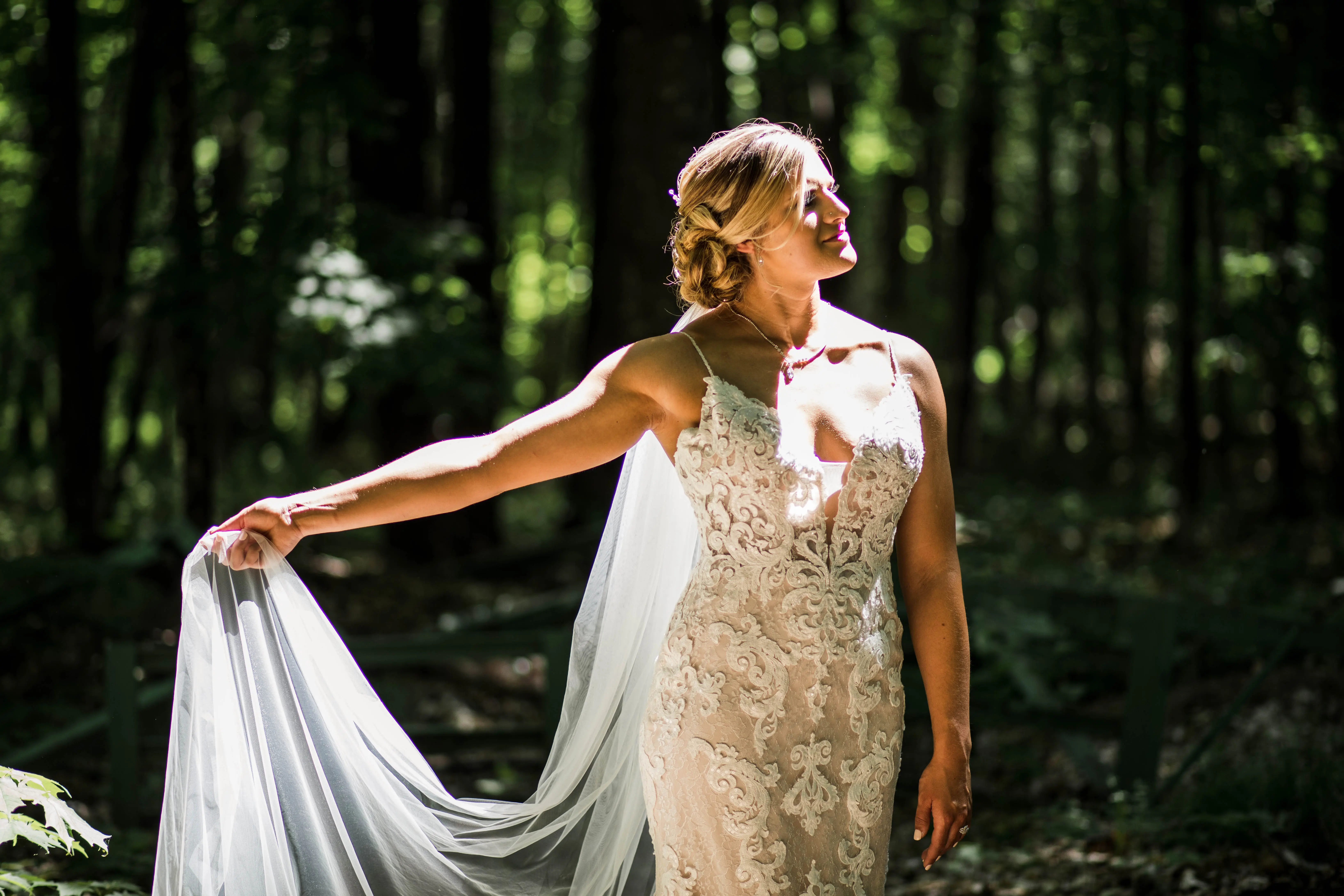 Bride wearing romantic lace sheath wedding dress