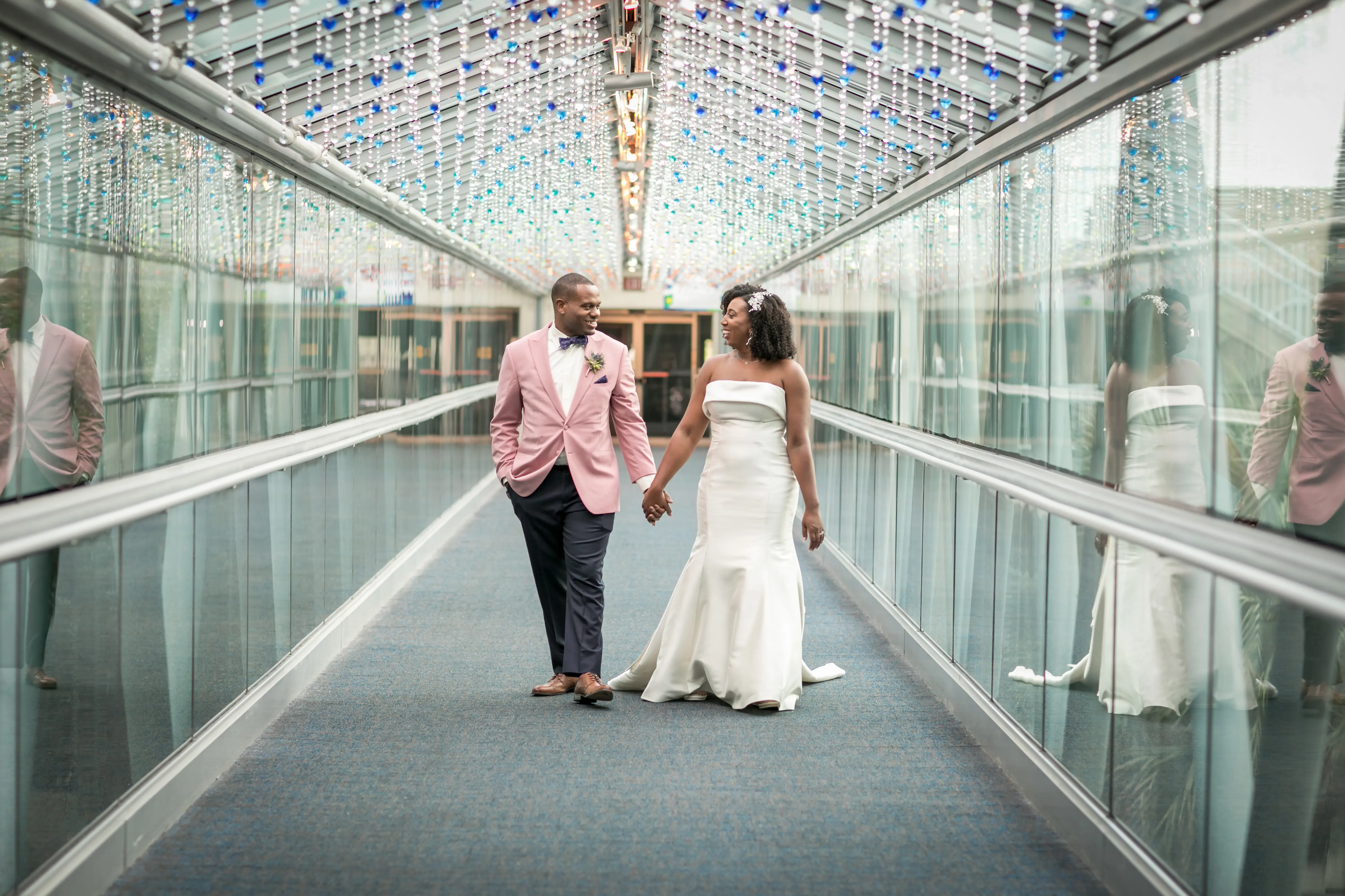 Groom Walking With Bride In Strapless Mermaid Wedding Dress Named Mitchell By Maggie Sottero