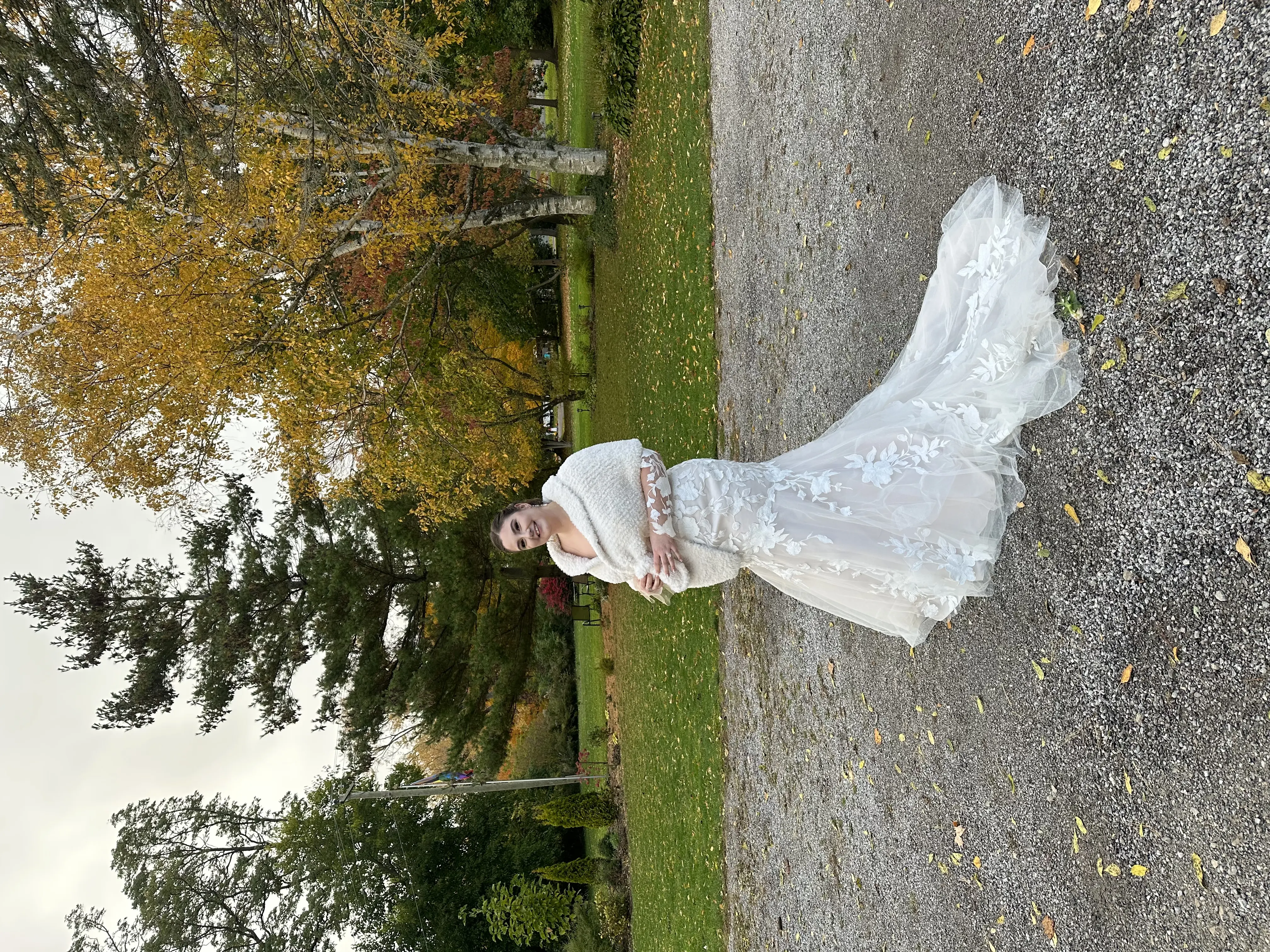 Bride wearing Hattie by Rebecca Ingram and a bridal wrap