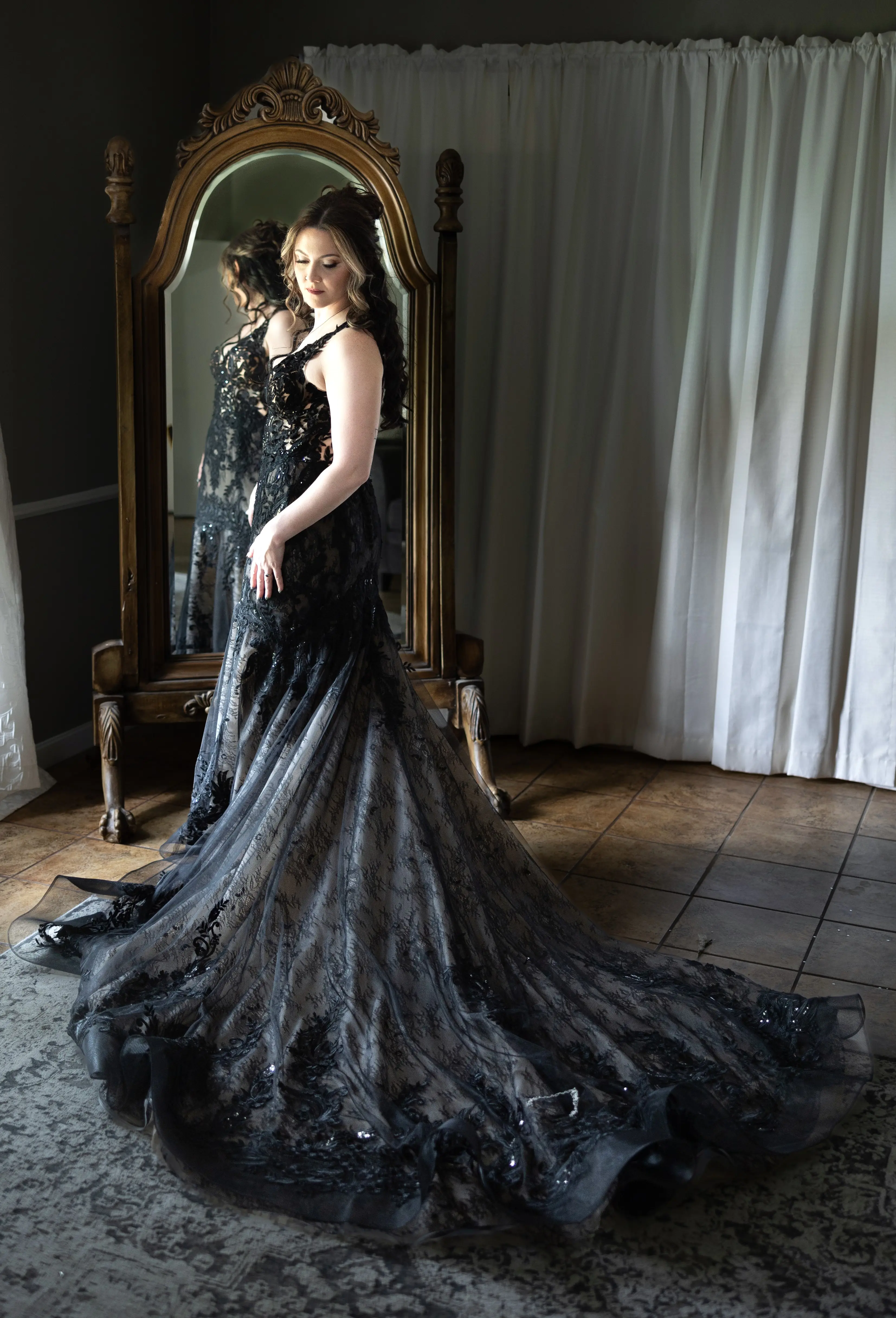 Bride wearing Zander Lane by Sottero and Midgley in front of a mirror