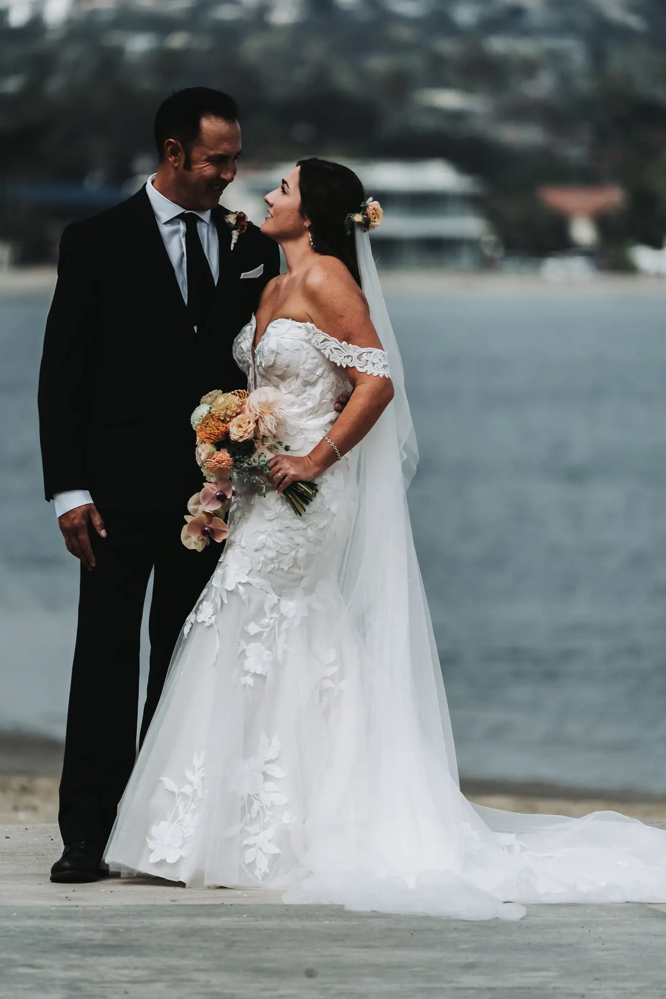 Groom With Bride Wearing Mermaid Wedding Dress With Oversized Lace Hattie By Rebecca Ingram