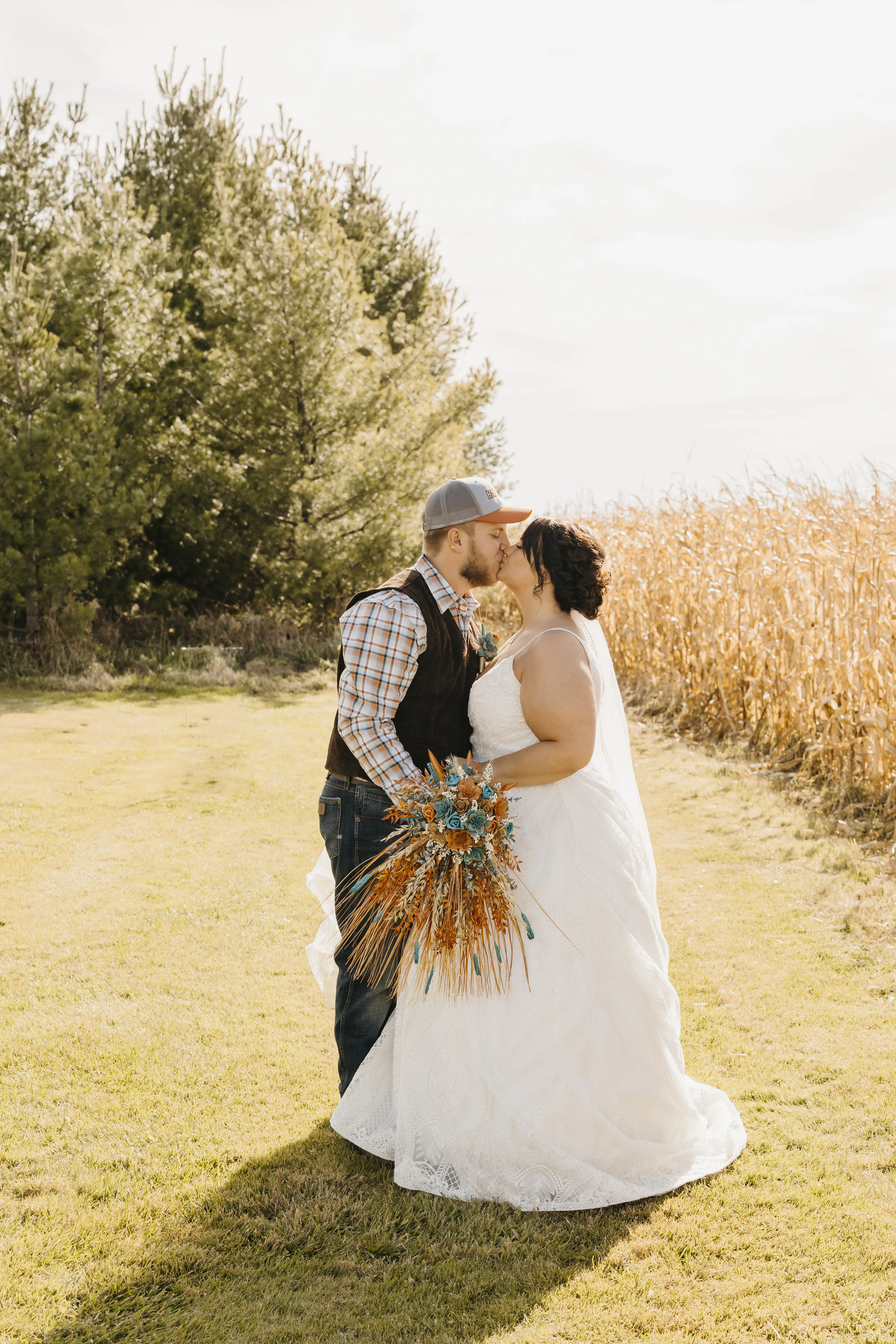 Groom Kissing Bride in Dreamy Boho Princess A-Line Wedding Dress Called Roxanne by Sottero & Midgley